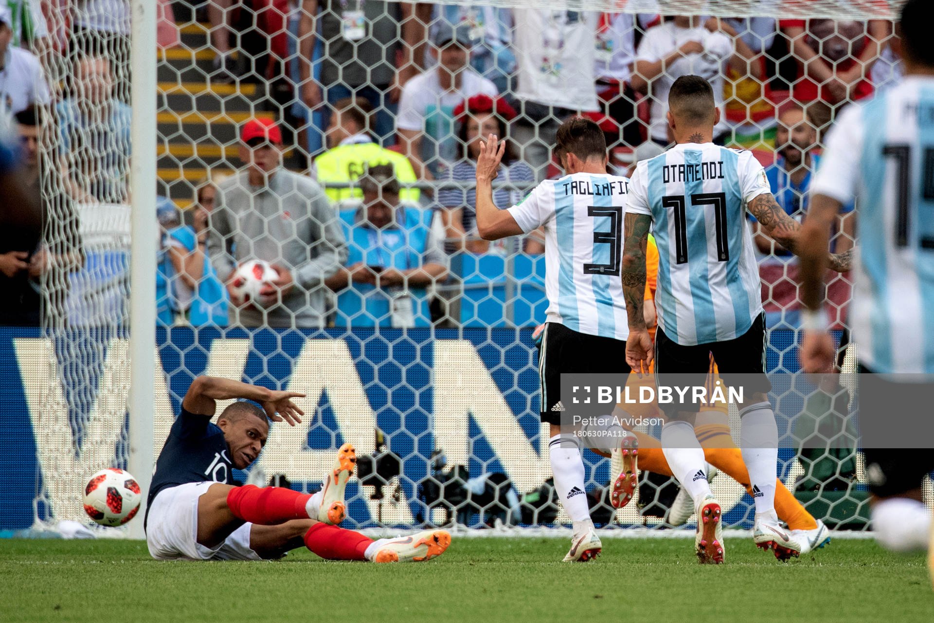 Kylian Mbappe of France goes down