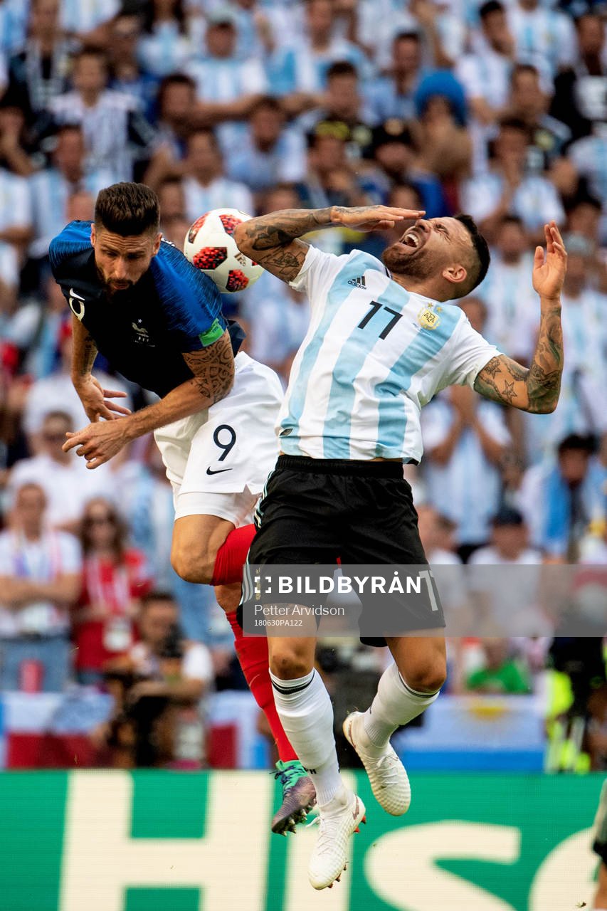 Olivier Giroud of France and Nicolas Otamendi of Argentina