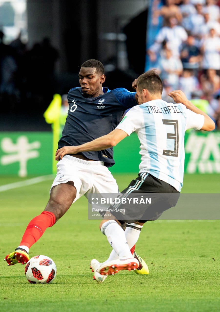 Paul Pogba of France and Nicolas Tagliafico of Argentina