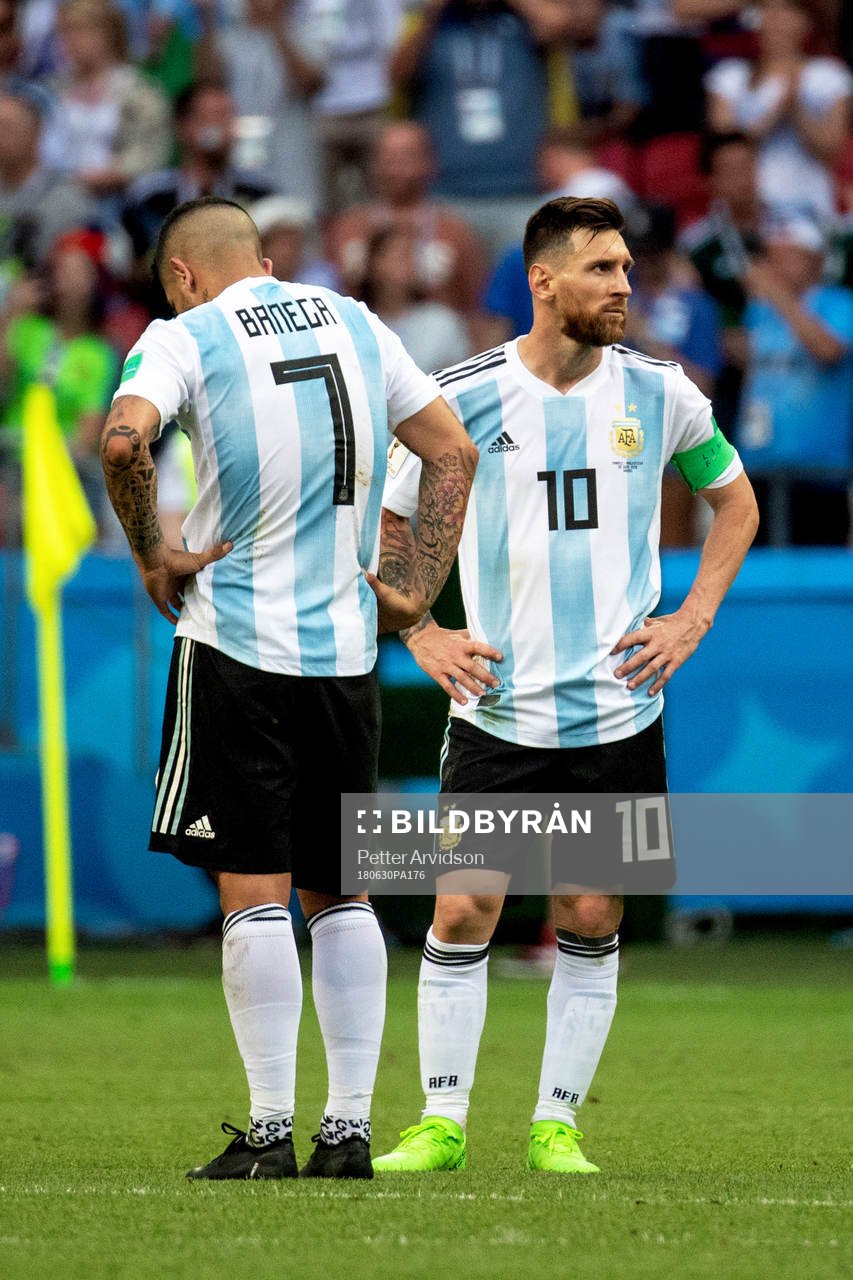 Ever Banega and Lionel Messi of Argentina looks dejected