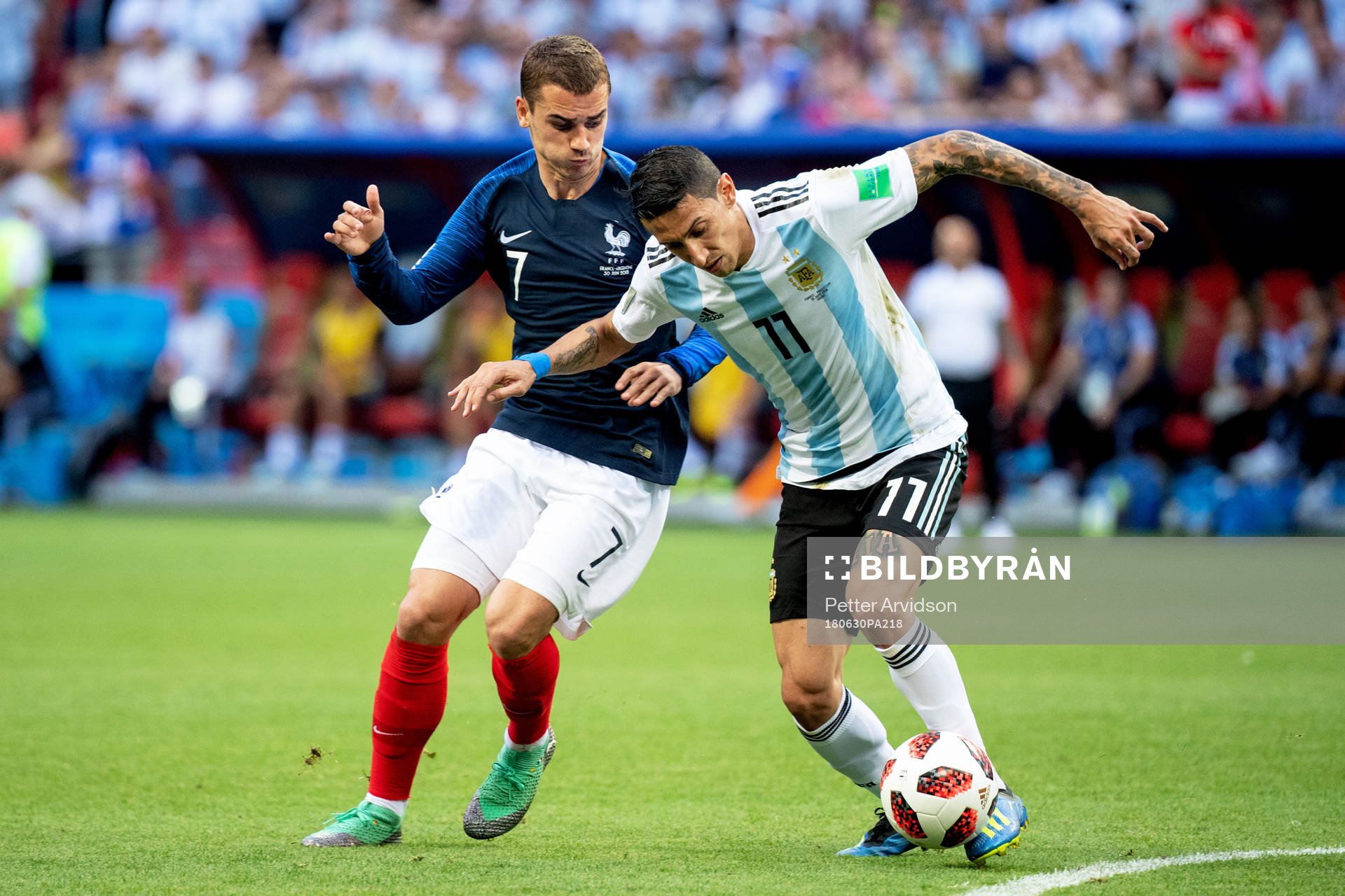 Antoine Griezmann of France and Angel Di Maria of Argentina