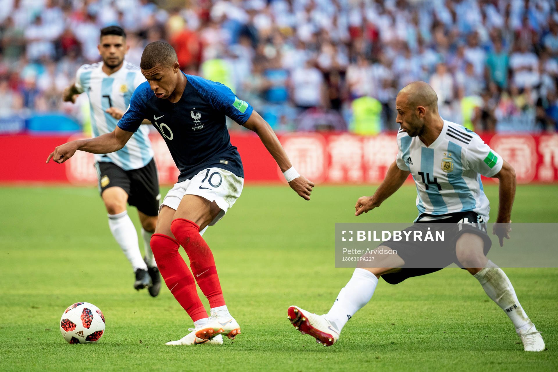 Kylian Mbappe of France and Javier Mascherano of Argentina
