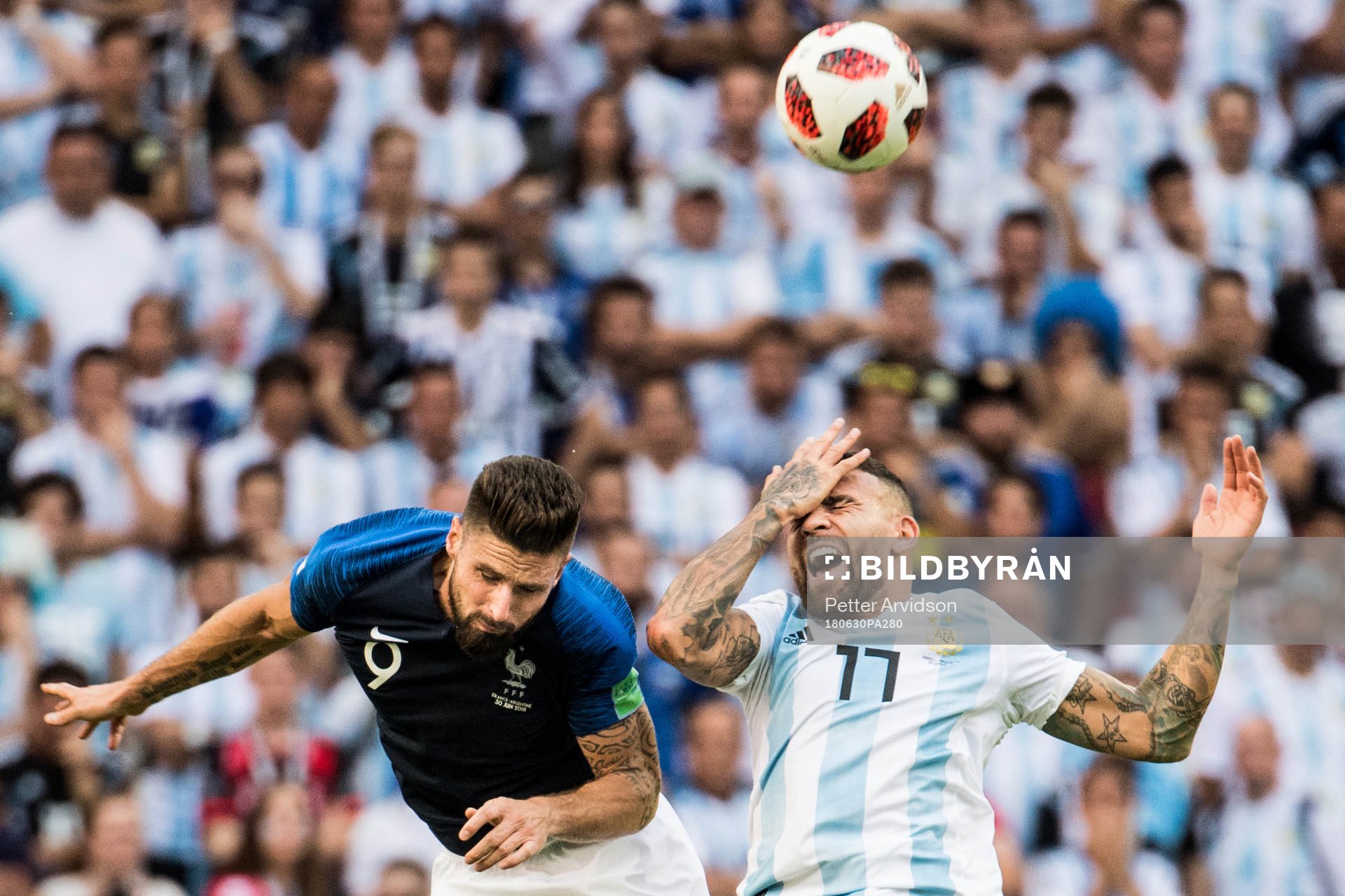 Olivier Giroud of France and Nicolas Otamendi of Argentina
