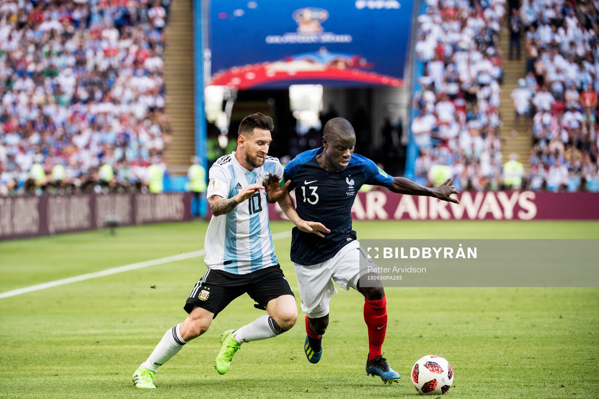 Lionel Messi of Argentina in action with Ngolo Kante of