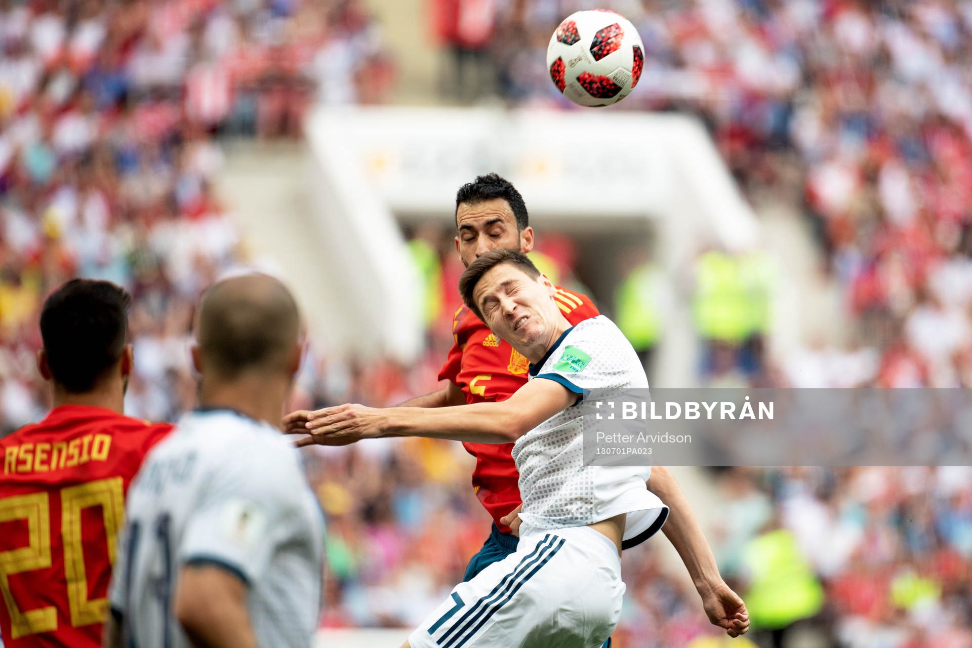 Sergio Busquets of Spain and Daler Kuziaev of Russia
