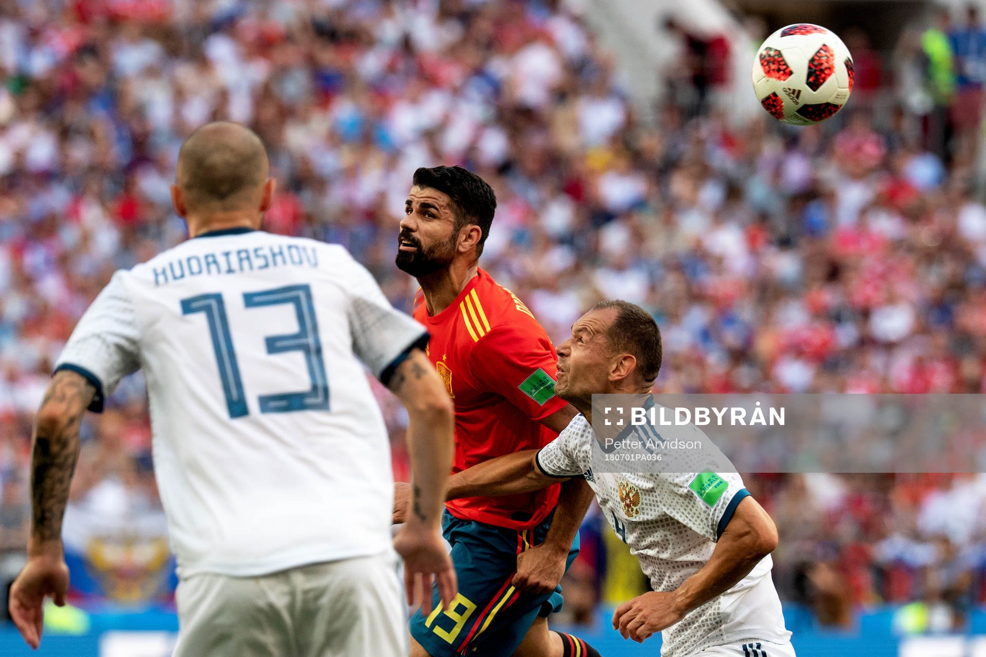 Diego Costa of Spain and Sergey Ignashevich of Russia