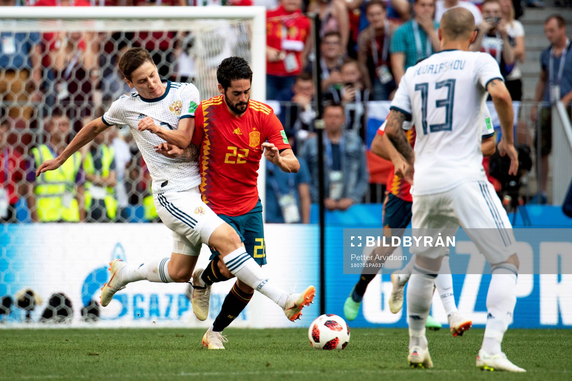Daler Kuziaev of Russia and Isco of Spain