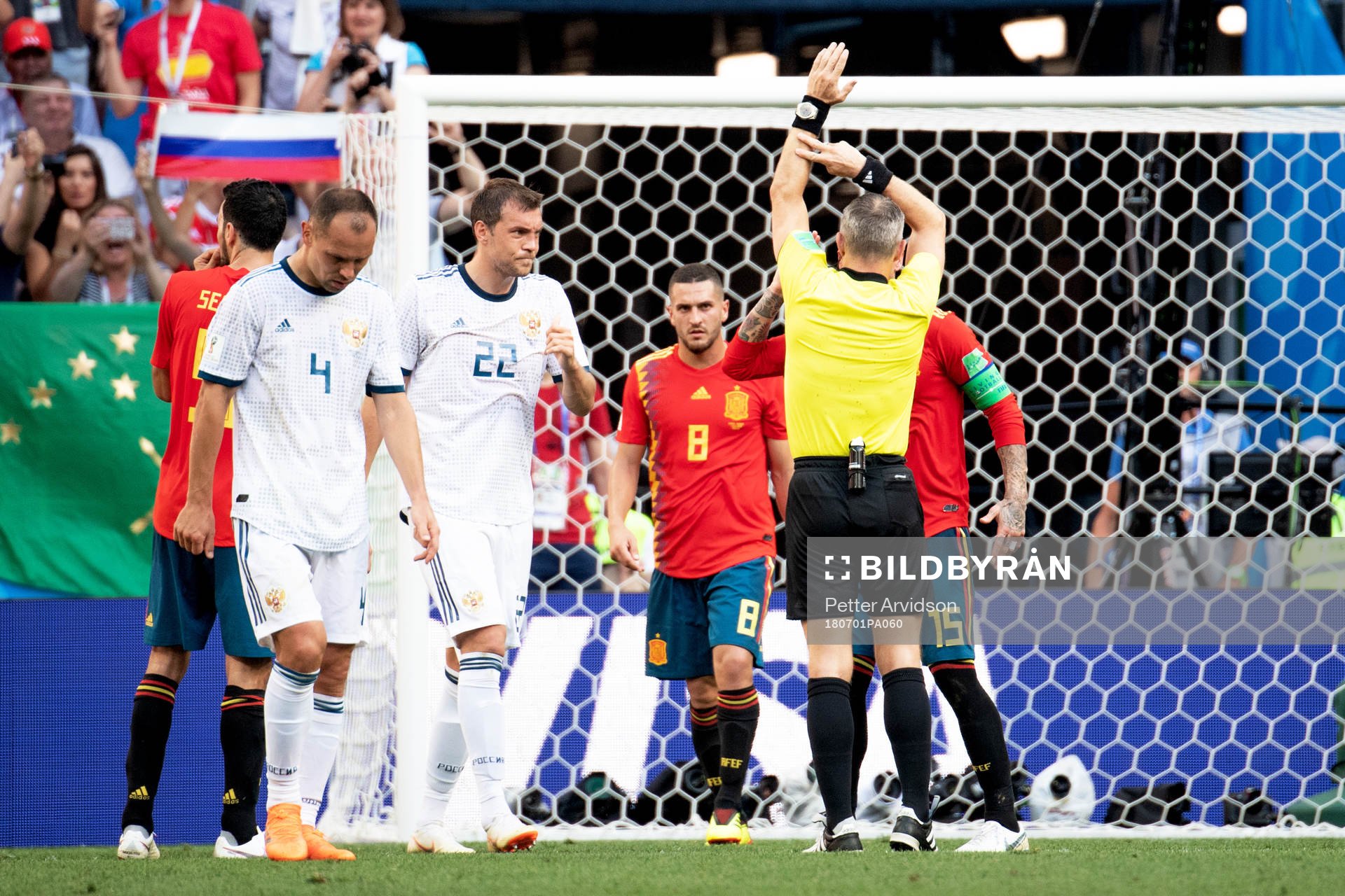 Handball by Gerard Pique of Spain and referee Björn