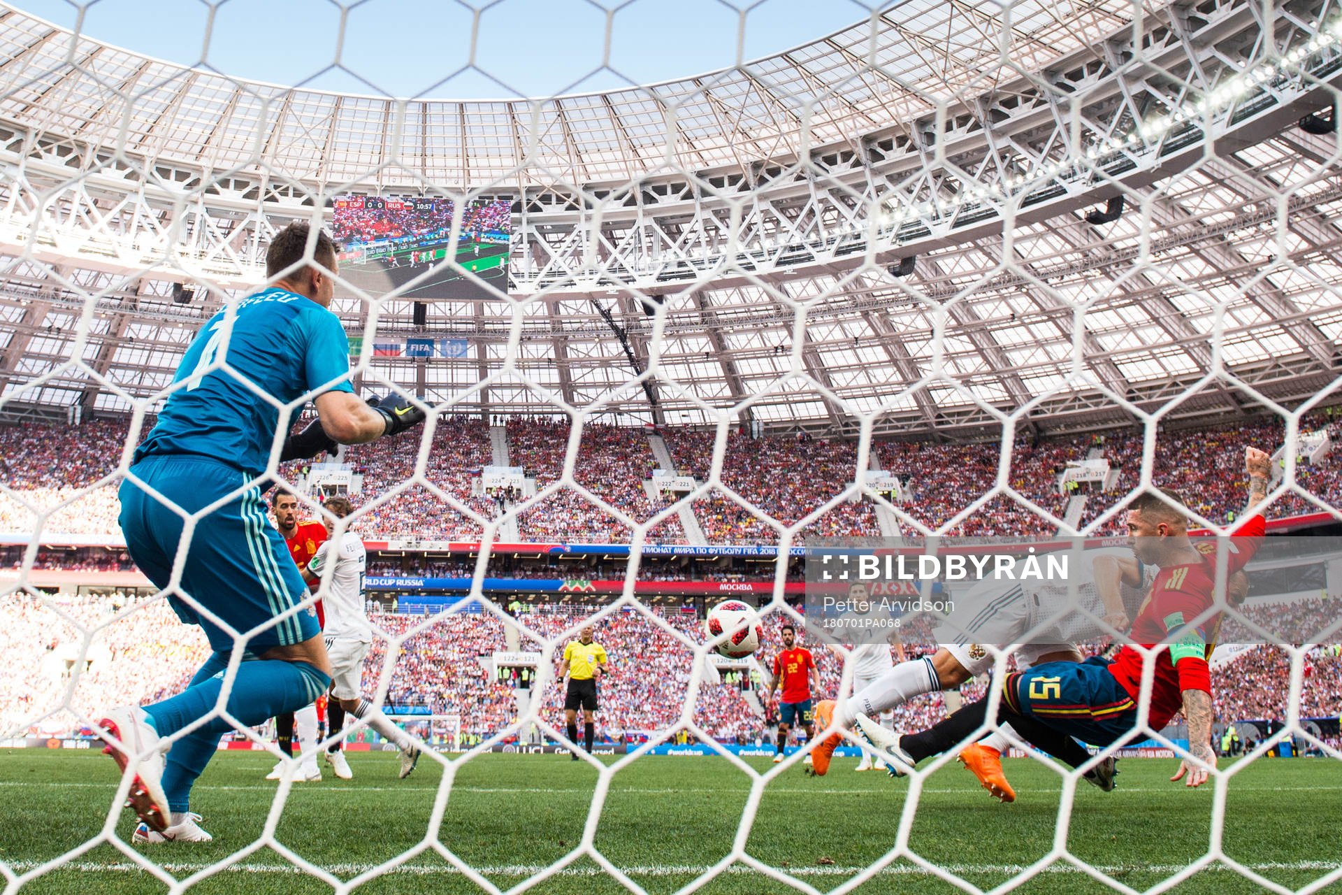 Sergio Ramos of Spain scores 1-0 behind goalkeeper Igor