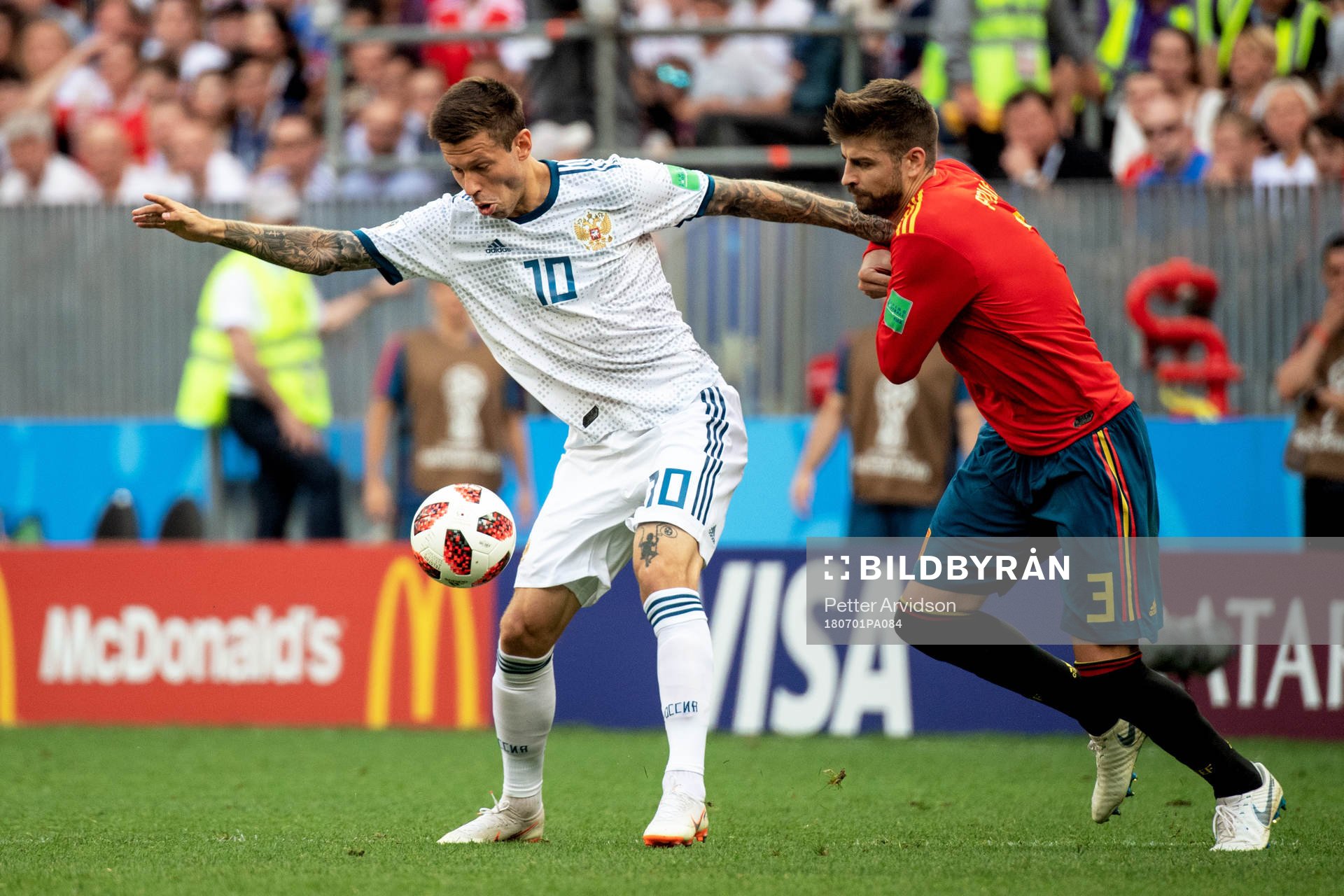 Fedor Smolov of Russia and Gerard Pique of Spain