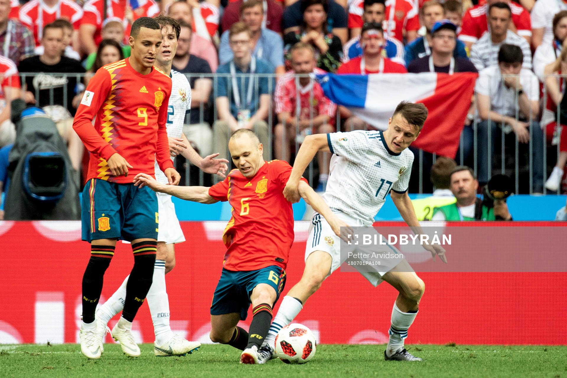 Andres Iniesta of Spain and Aleksandr Golovin of Russia during the FIFA World Cup round of 16 match between Spain and Russia on July 1, 2018 in Moscow.