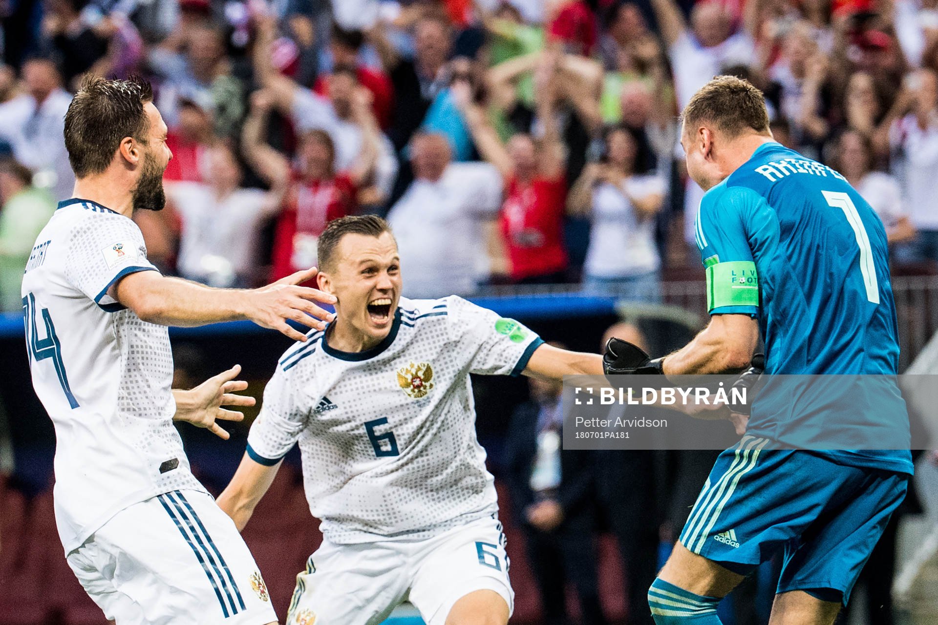 Vladimir Granat, Denis Cheryshev and goalkeeper Igor Akinfeev of Russia celebrates after the penalty shoot-out during the FIFA World Cup round of 16 match between Spain and Russia on July 1, 2018 in Moscow.