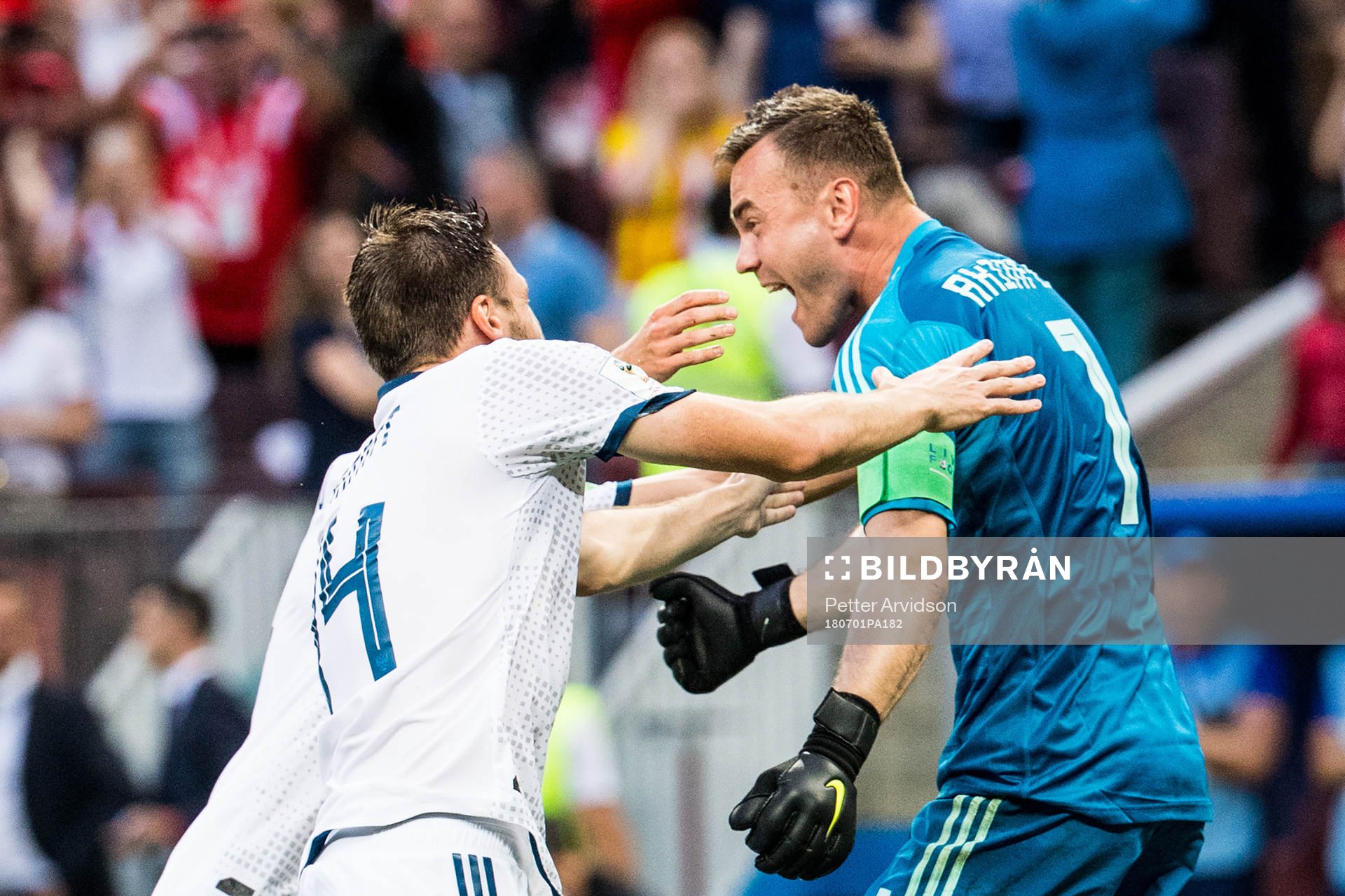 Goalkeeper Igor Akinfeev of Russia celebrates with Vladimir Granat after the penalty shoot-out during the FIFA World Cup round of 16 match between Spain and Russia on July 1, 2018 in Moscow.