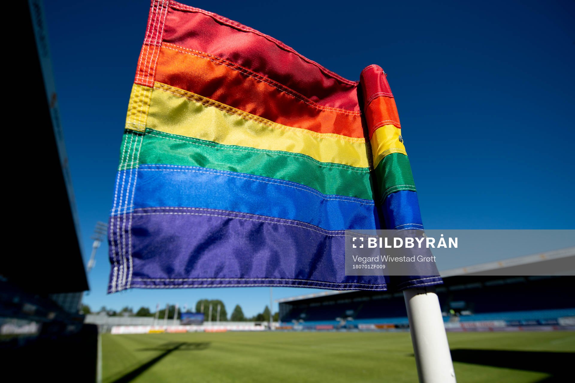 A rainbow-colored corner flag at Komplett Arena