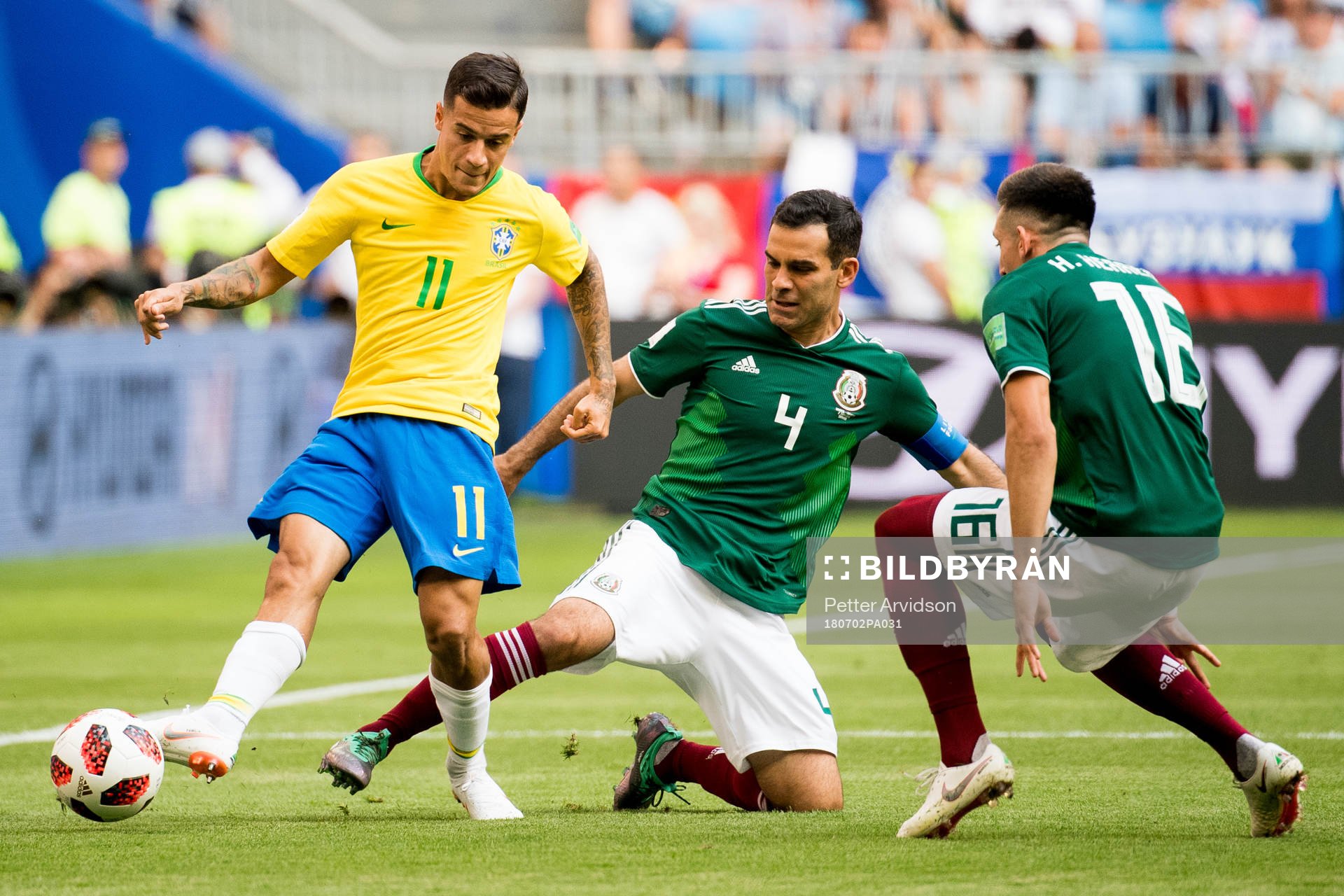 Philippe Coutinho of Brazil and Rafael Marquez of Mexico