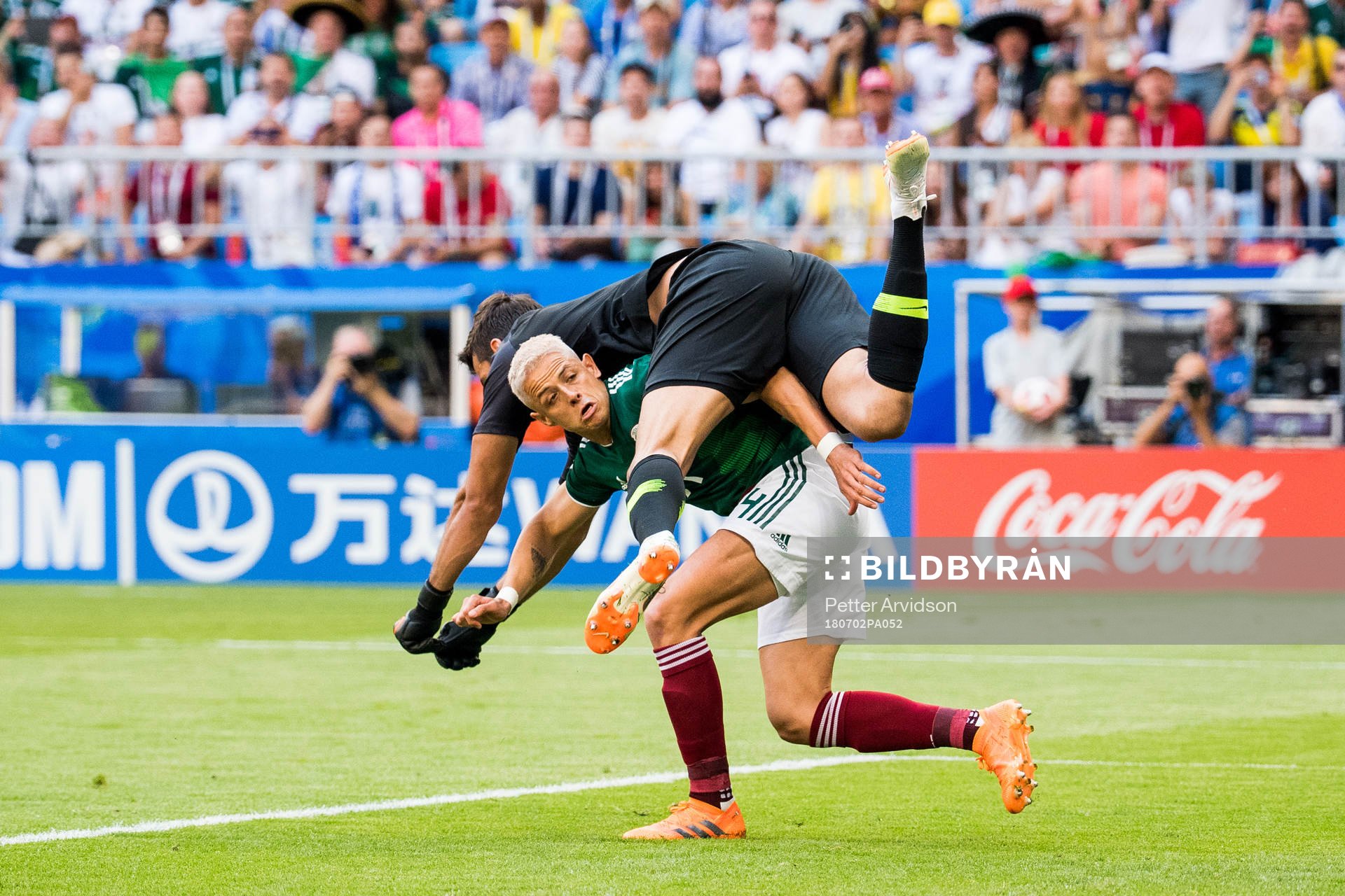 Goalkeeper Alisson of Brazil and Javier Hernandez of Mexico during the FIFA World Cup round of 16 match between Brazil and Mexico on July 2, 2018 in Samara.