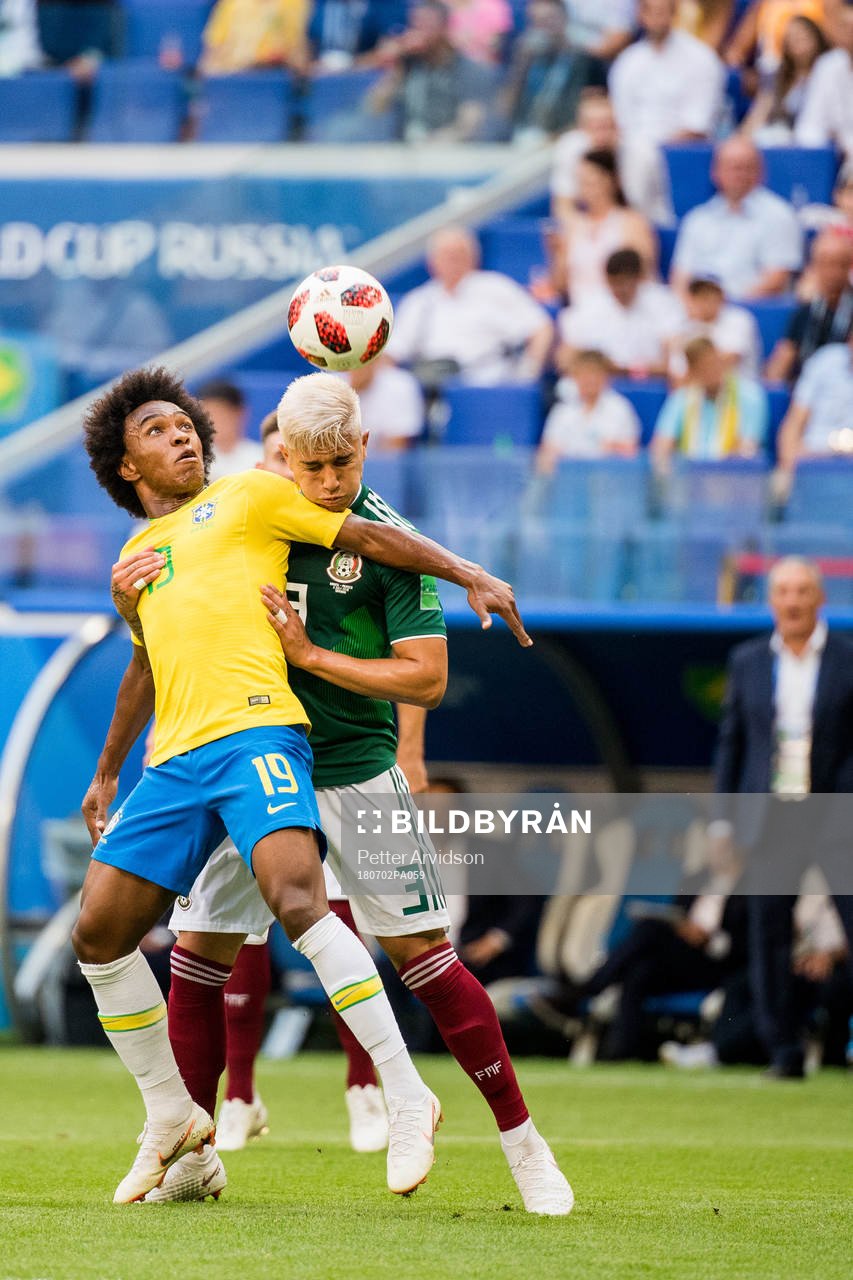 Willian of Brazil and Carlos Salcedo of Mexico