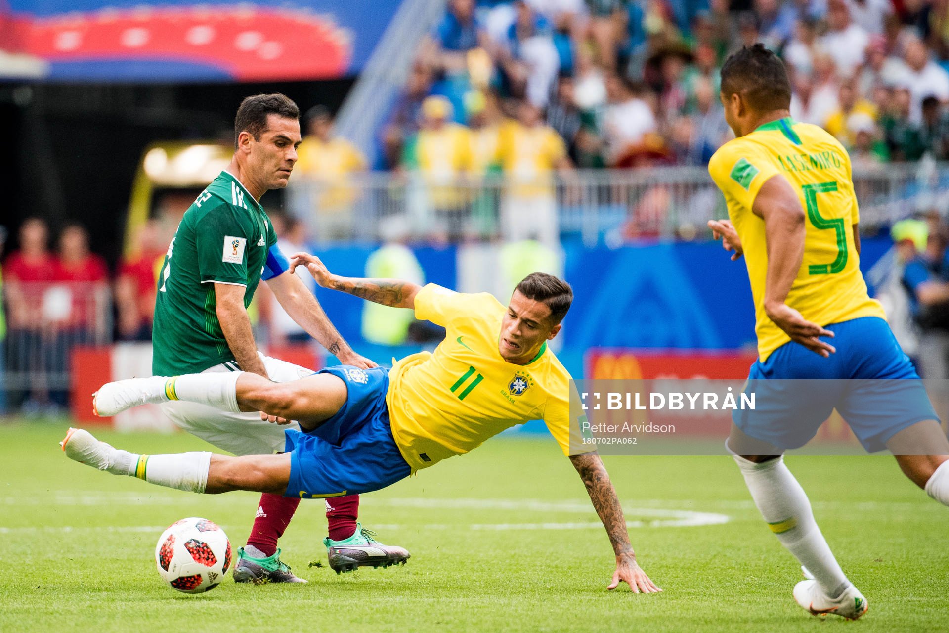 Rafael Marquez of Mexico and Philippe Coutinho of Brazil