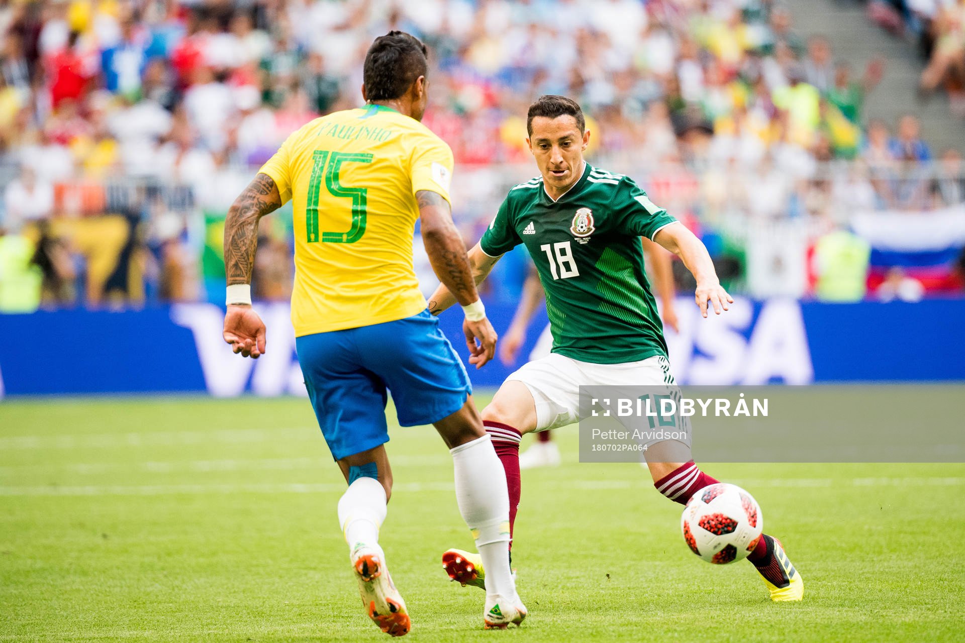 Paulinho of Brazil and Andres Guardado of Mexico during the FIFA World Cup round of 16 match between Brazil and Mexico on July 2, 2018 in Samara.