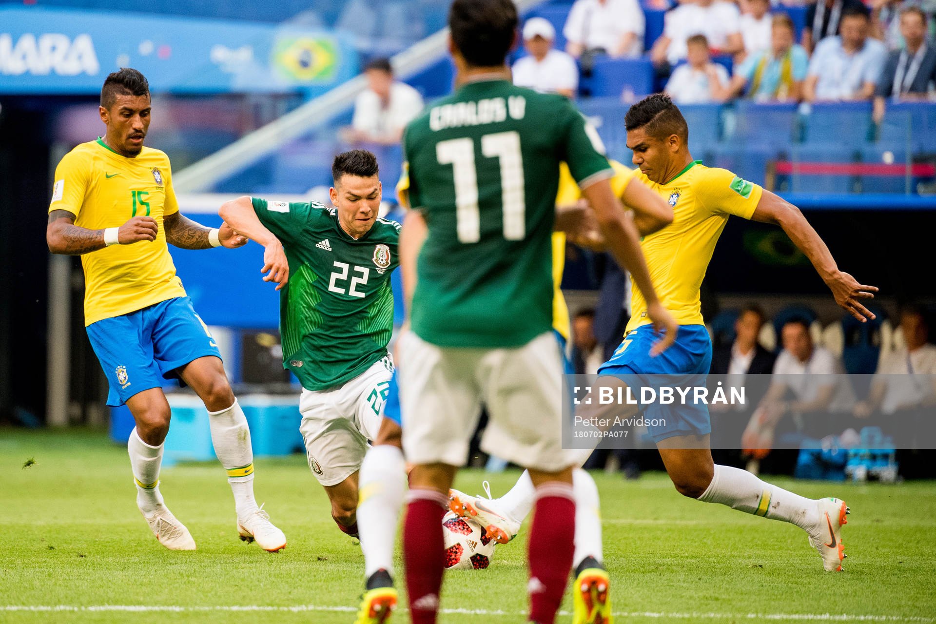 Paulinho of Brazil and Hirving Lozano of Mexico