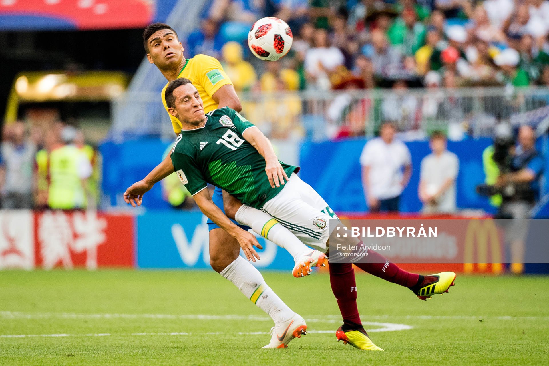 Andres Guardado of Mexico and Casemiro of Brazil during the FIFA World Cup round of 16 match between Brazil and Mexico on July 2, 2018 in Samara.