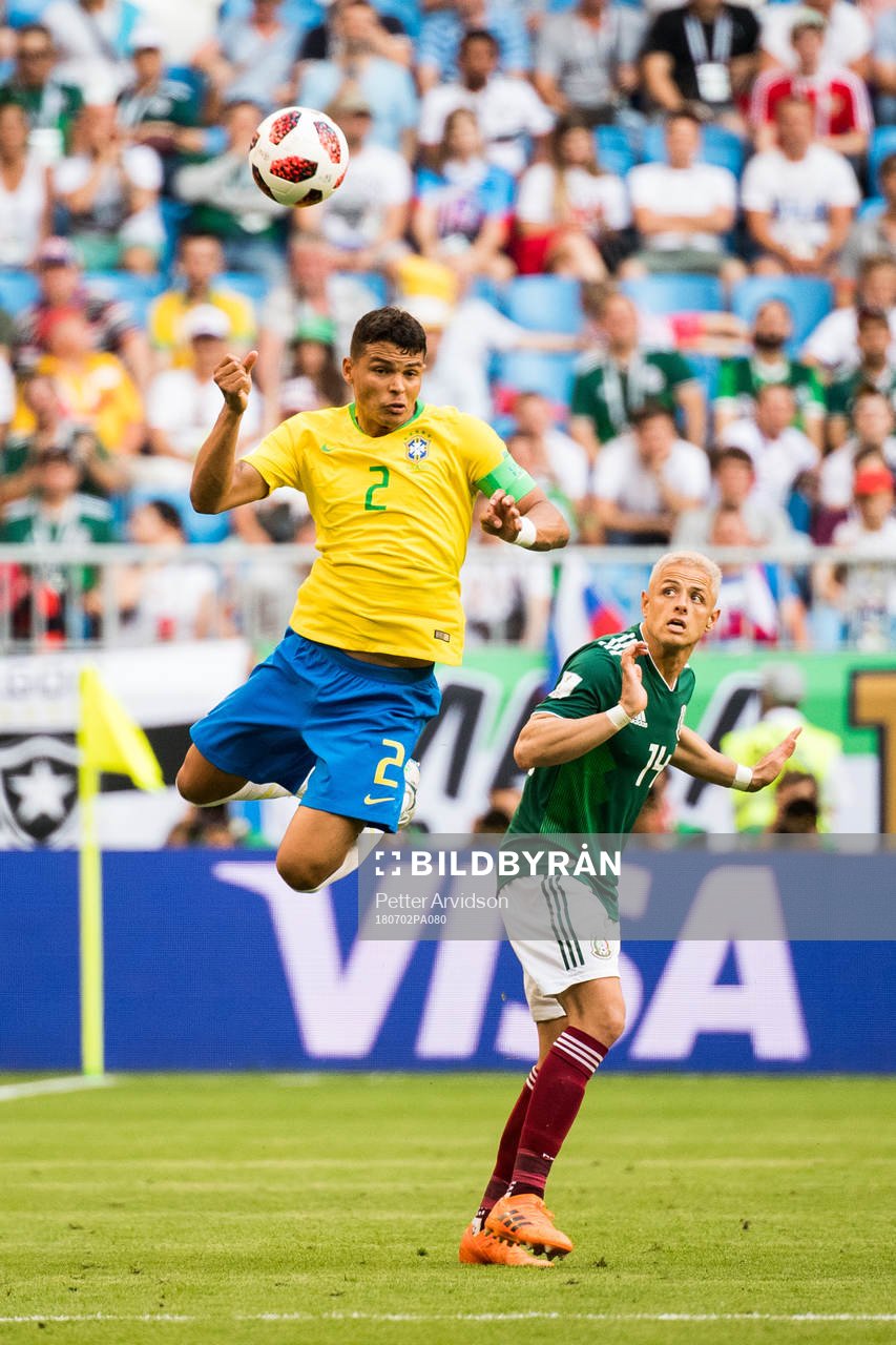 Thiago Silva of Brazil and Javier Hernandez of Mexico