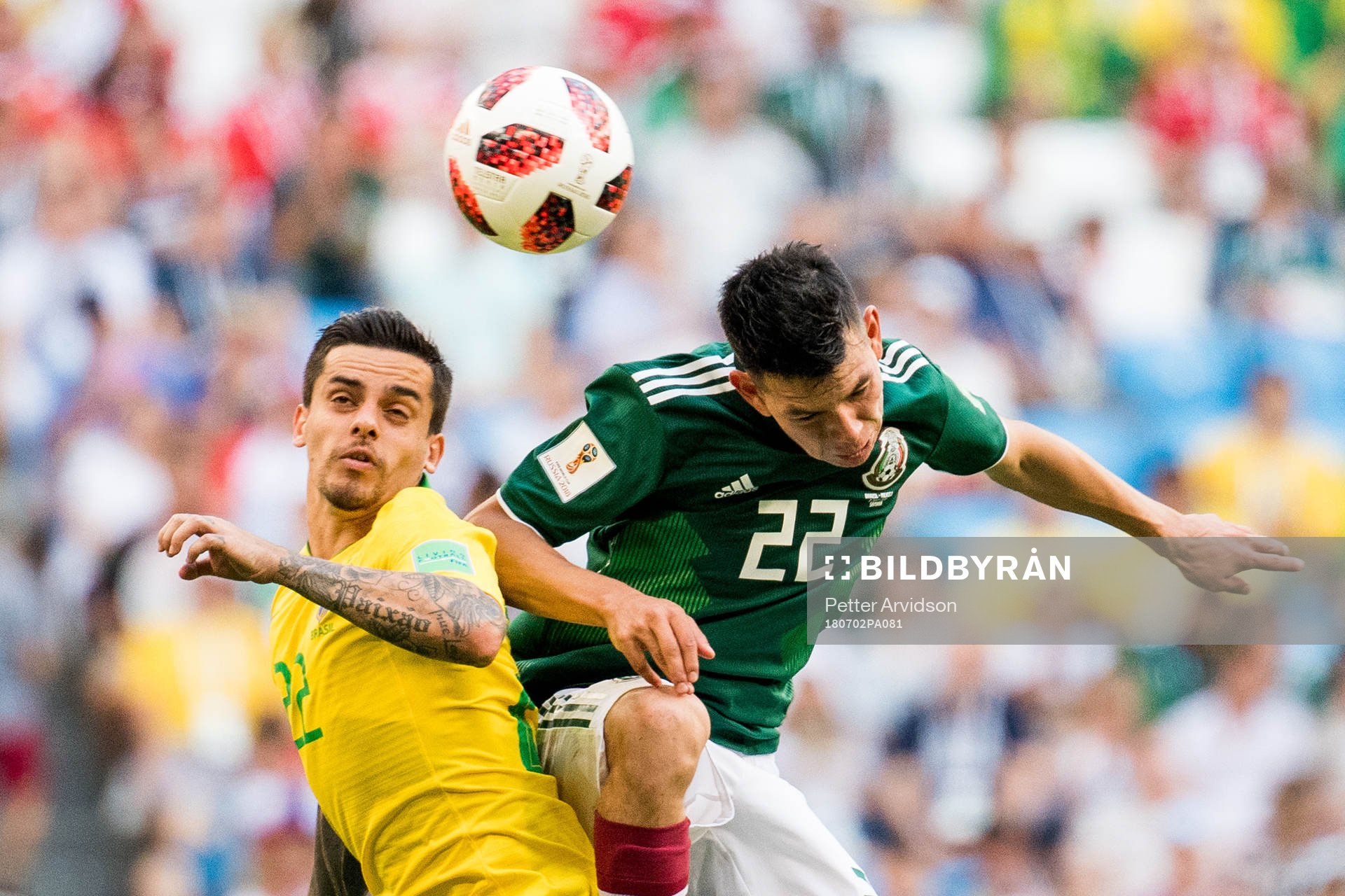Fagner of Brazil and Hirving Lozano of Mexico