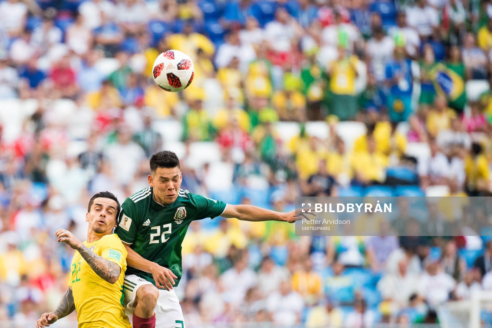 Fagner of Brazil and Hirving Lozano of Mexico