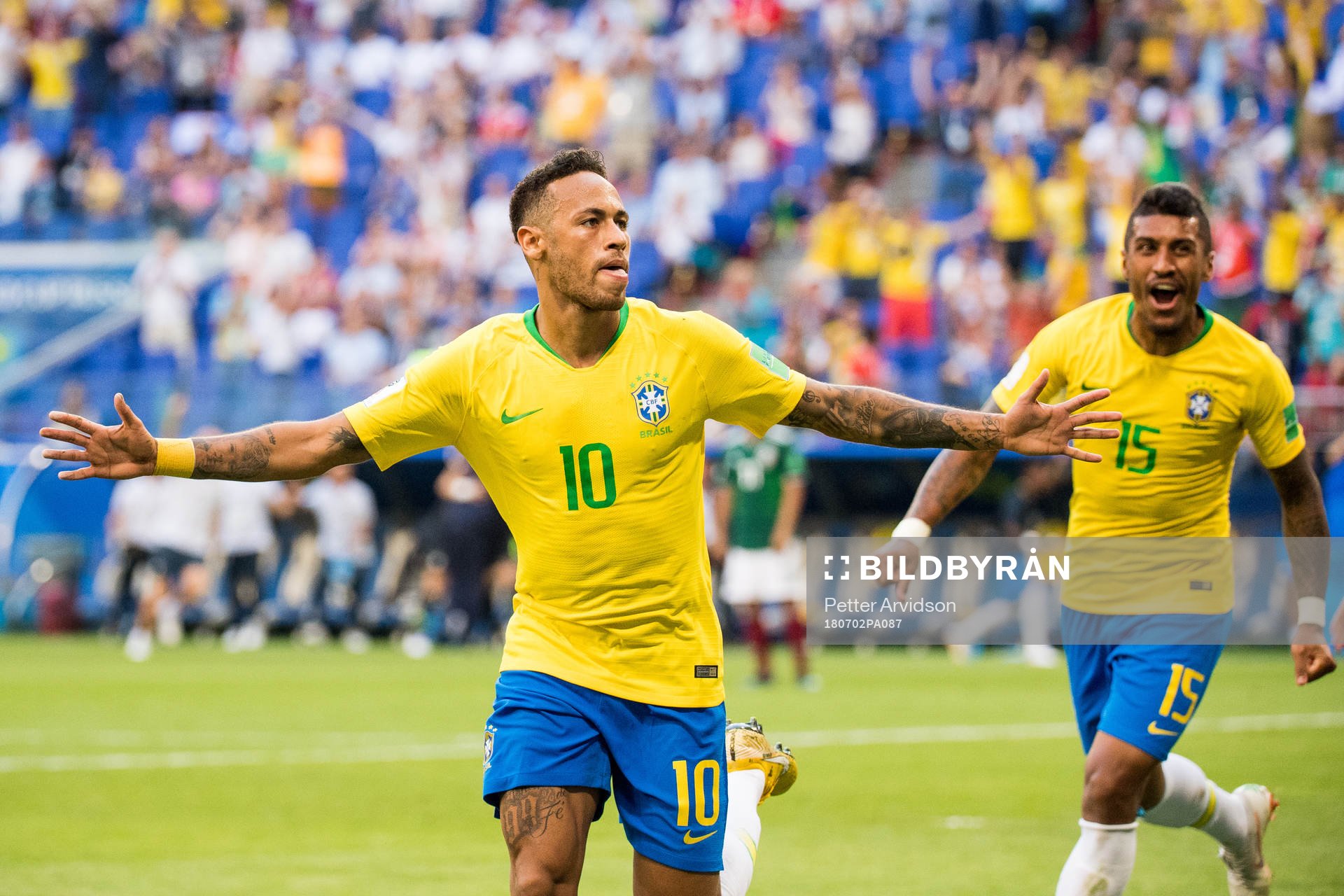 Neymar and Paulinho of Brazil celebrate the 1-0 goal