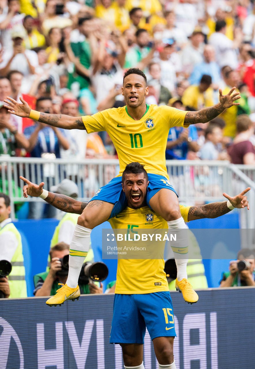 Neymar and Paulinho of Brazil celebrate the 1-0 goal