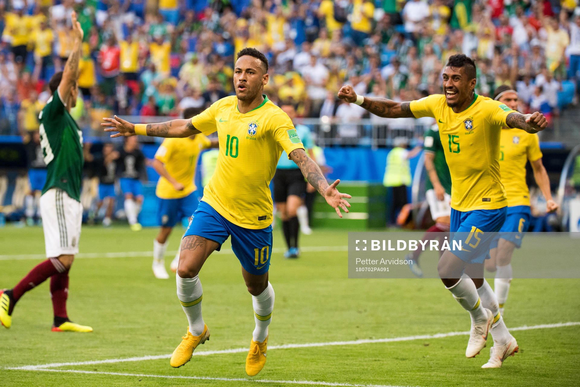 Neymar and Paulinho of Brazil celebrate the 1-0 goal
