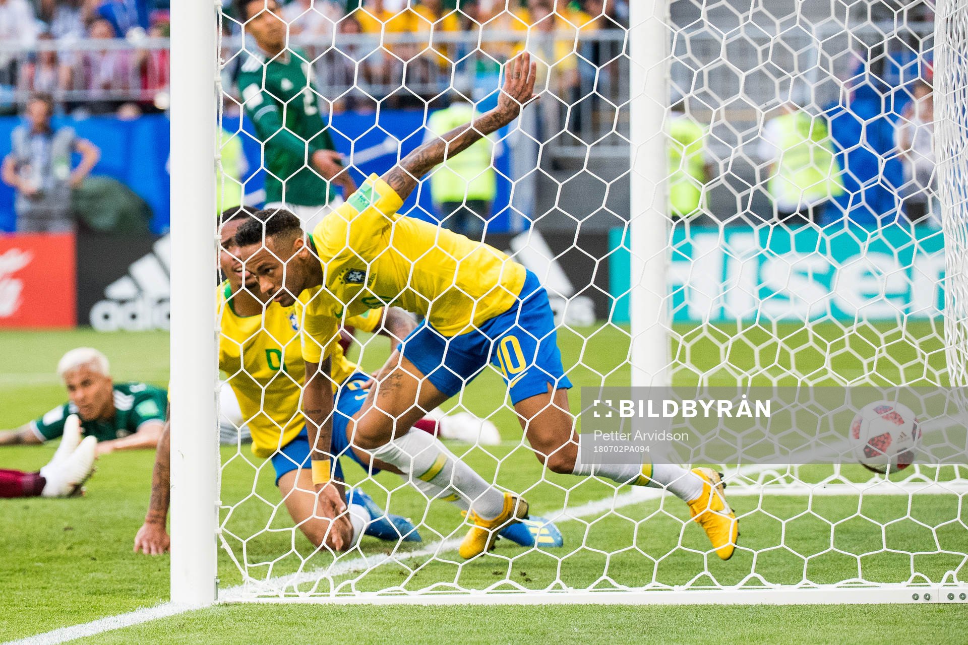Neymar and Paulinho of Brazil celebrate the 1-0 goal during the FIFA World Cup round of 16 match between Brazil and Mexico on July 2, 2018 in Samara.