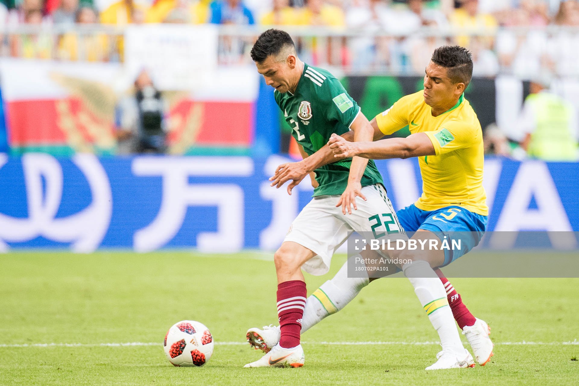 Hirving Lozano of Mexico and Casemiro of Brazil
