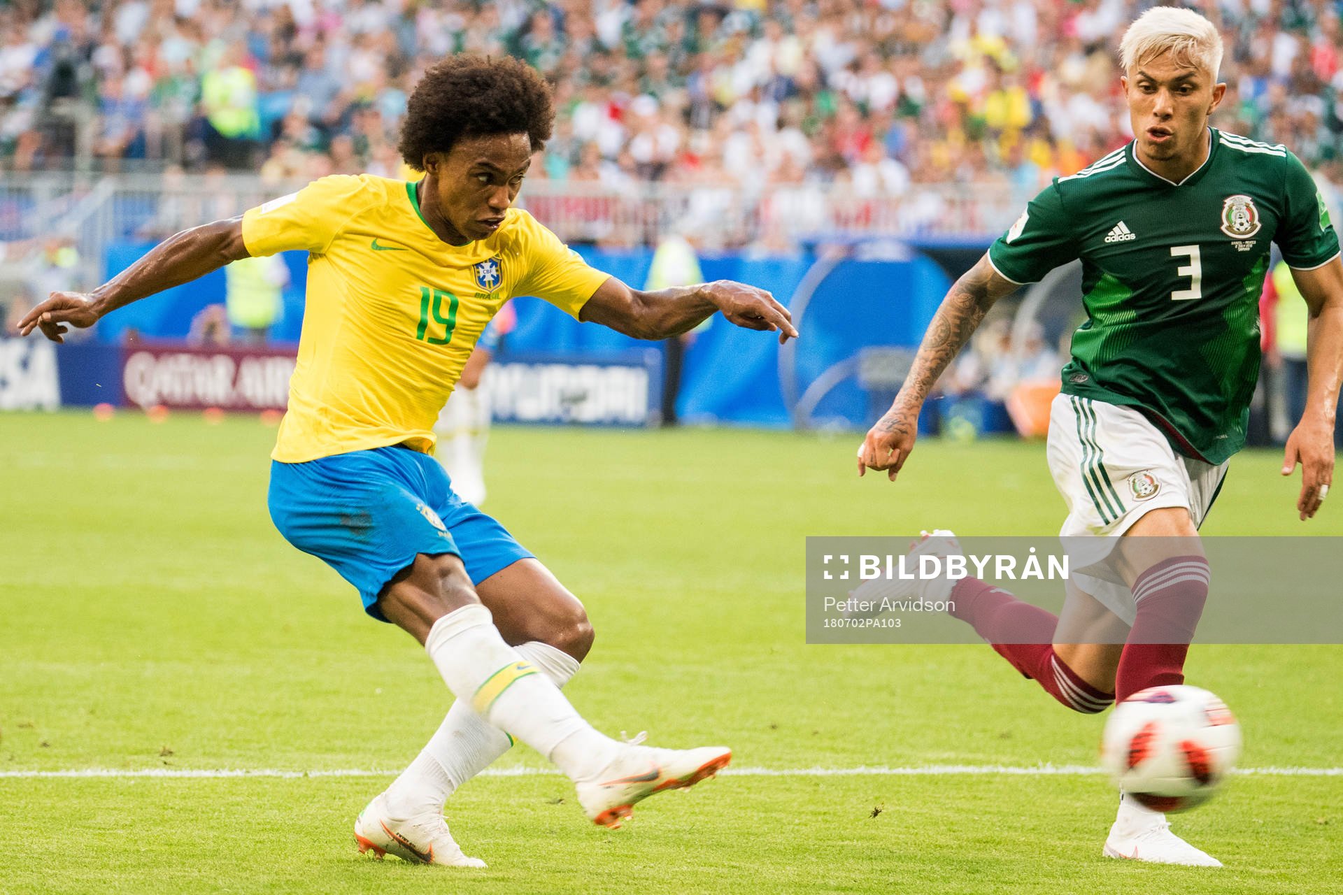Willian of Brazil and Carlos Salcedo of Mexico