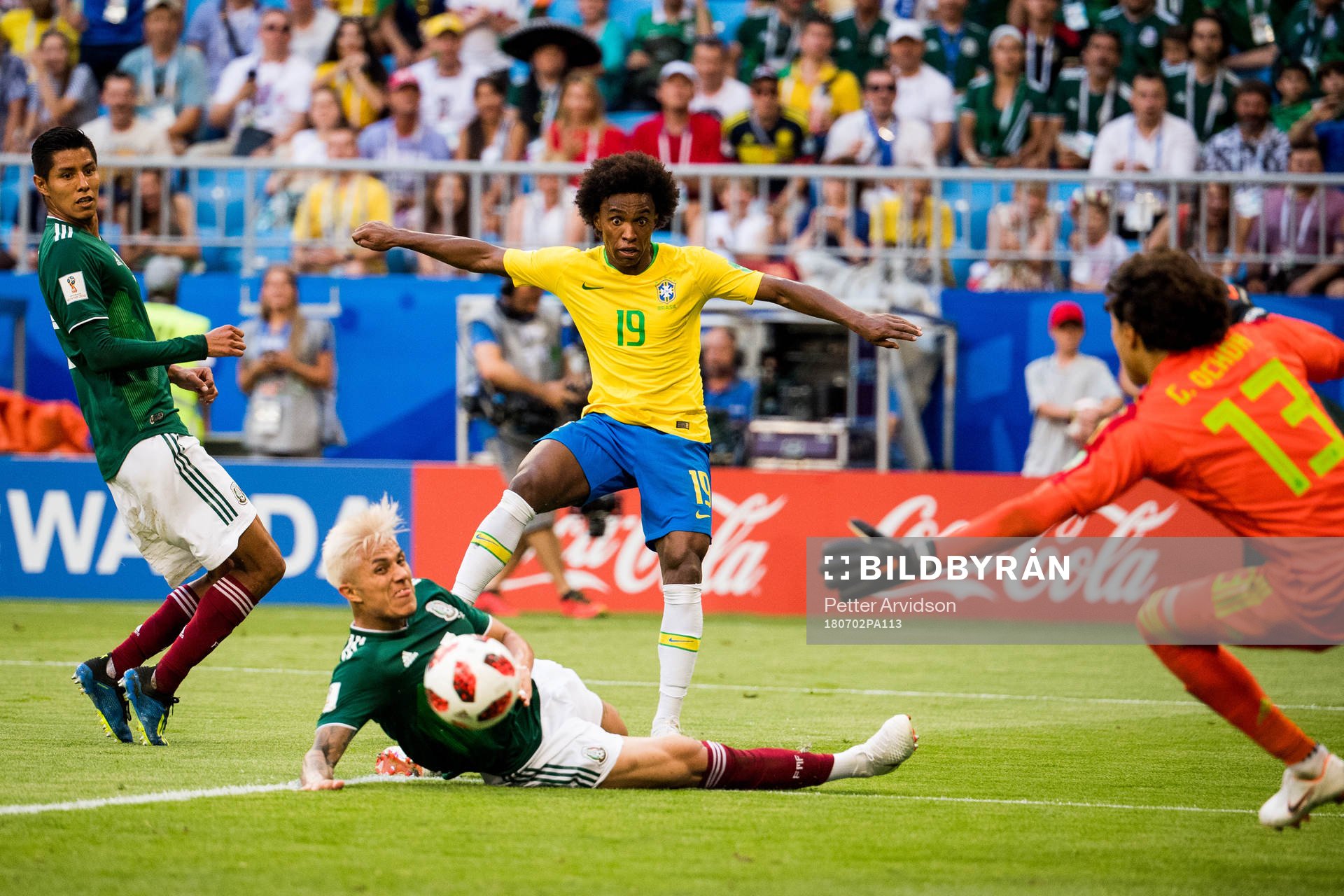 Carlos Salcedo of Mexico and Willian of Brazil