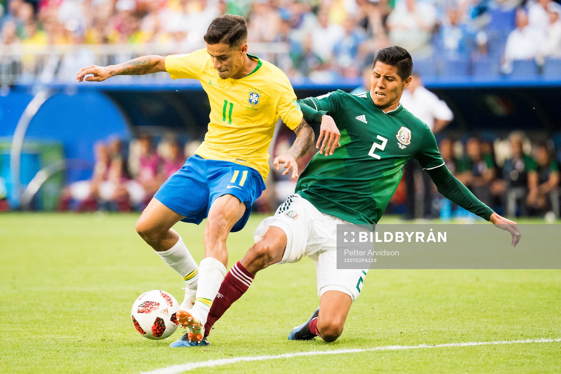 Philippe Coutinho of Brazil and Hugo Ayala of Mexico
