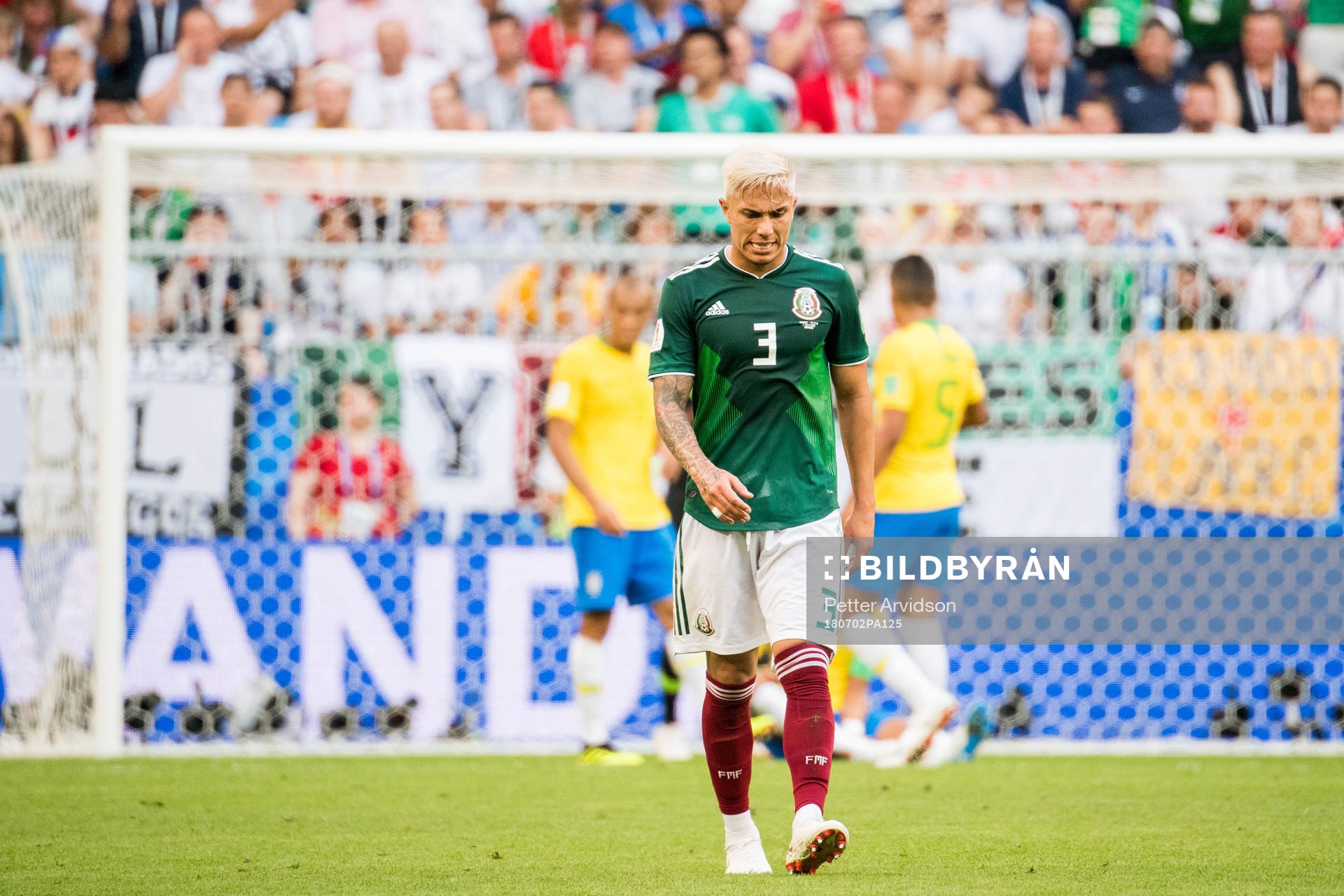Carlos Salcedo of Mexico looks dejected