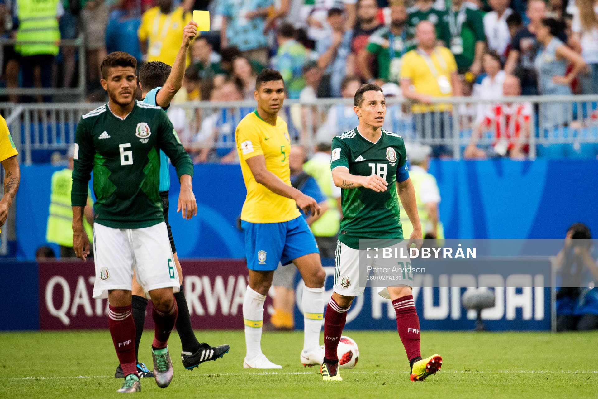 Andres Guardado of Mexico is shown a yellow card during the FIFA World Cup round of 16 match between Brazil and Mexico on July 2, 2018 in Samara.