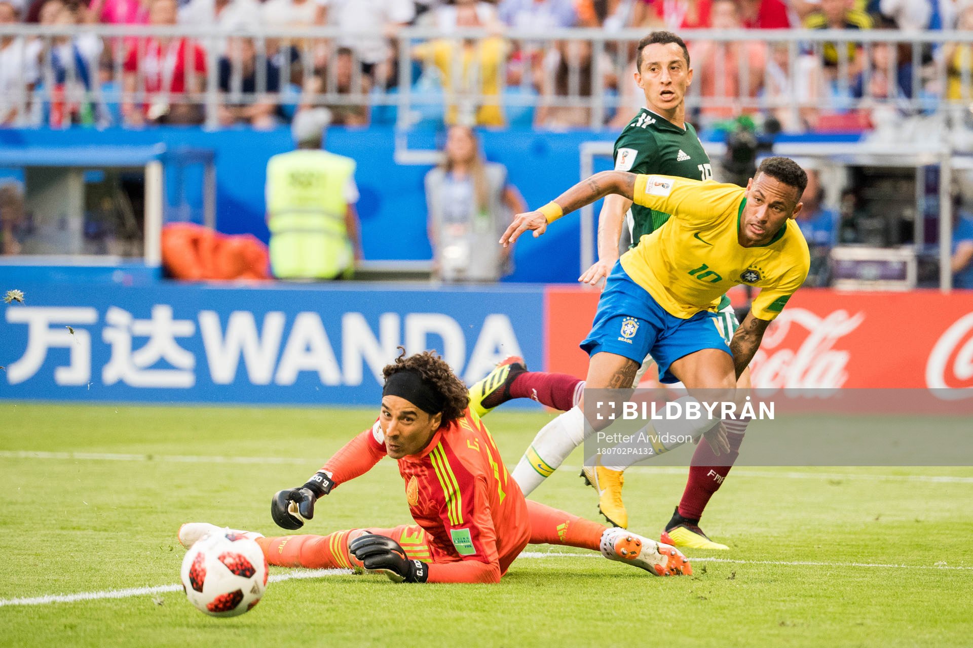 Goalkeeper Guillermo Ochoa of Mexico and Neymar of Brazil