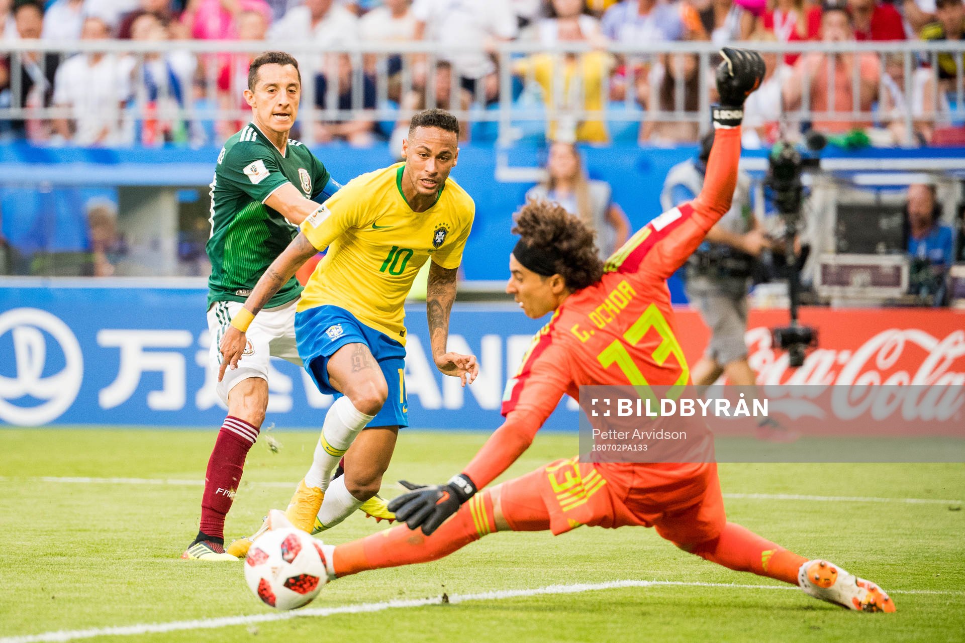 Neymar of Brazil and goalkeeper Guillermo Ochoa of Mexico