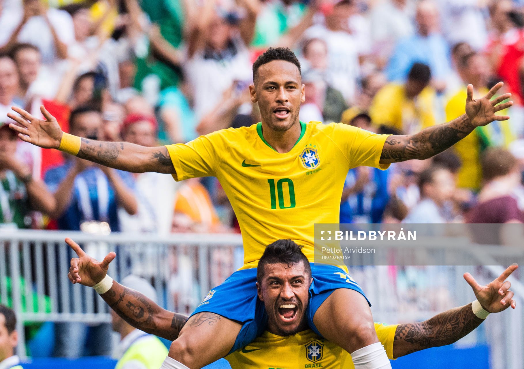 Neymar of Brazil celebrates with Paulinho