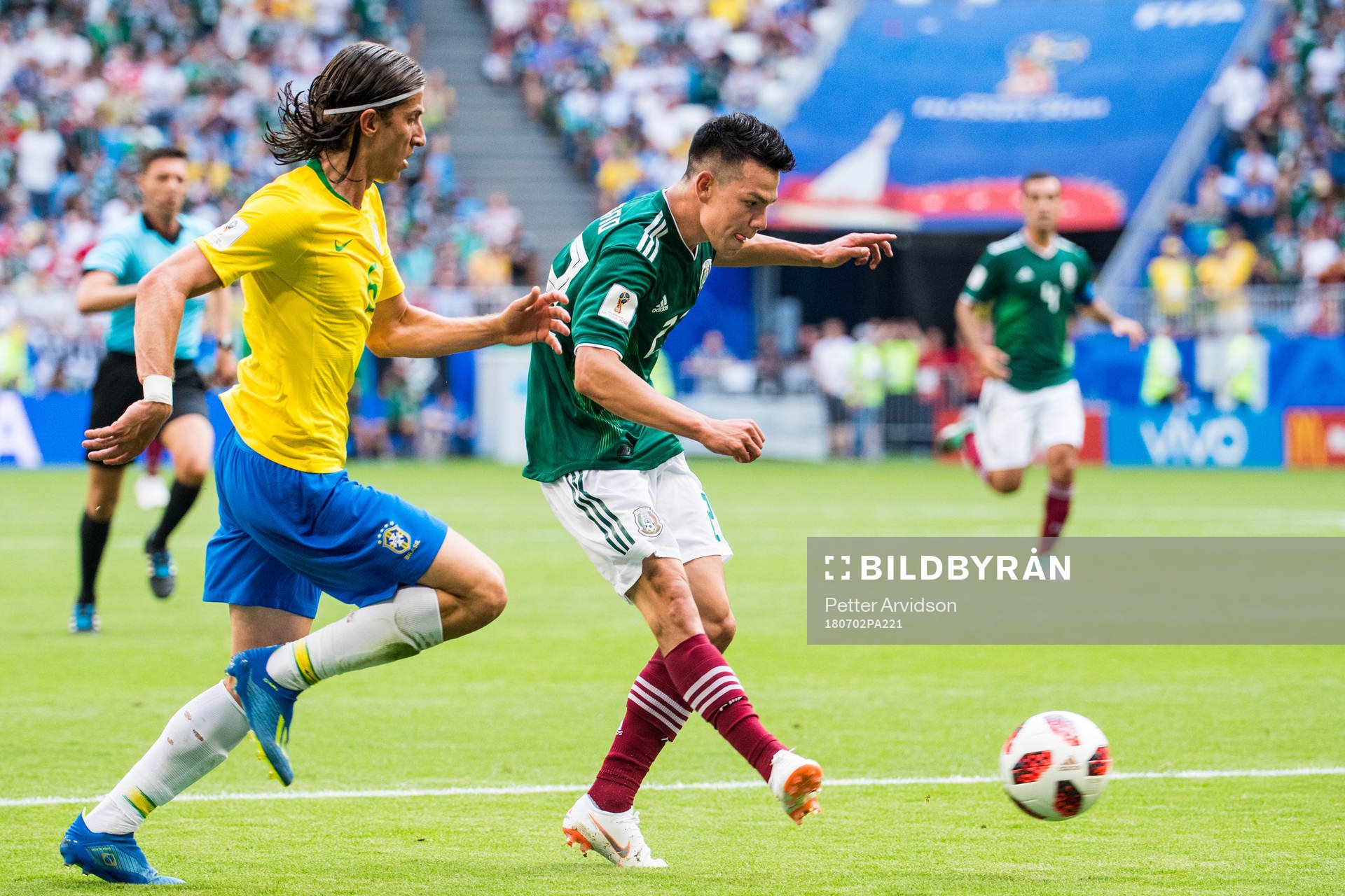 Hirving Lozano of Mexico and Filipe Luis of Brazil