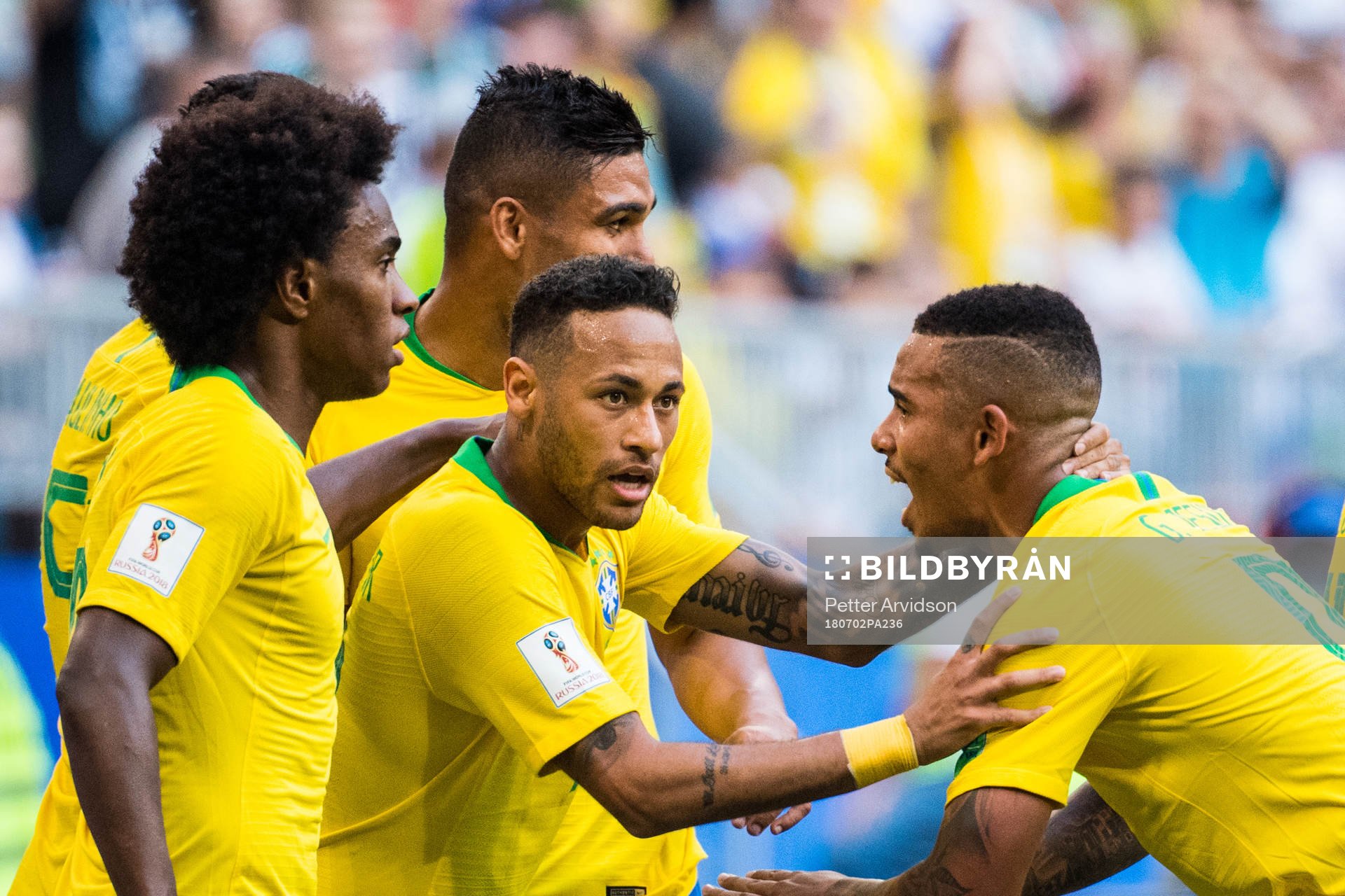 Neymar of Brazil celebrates with team mates