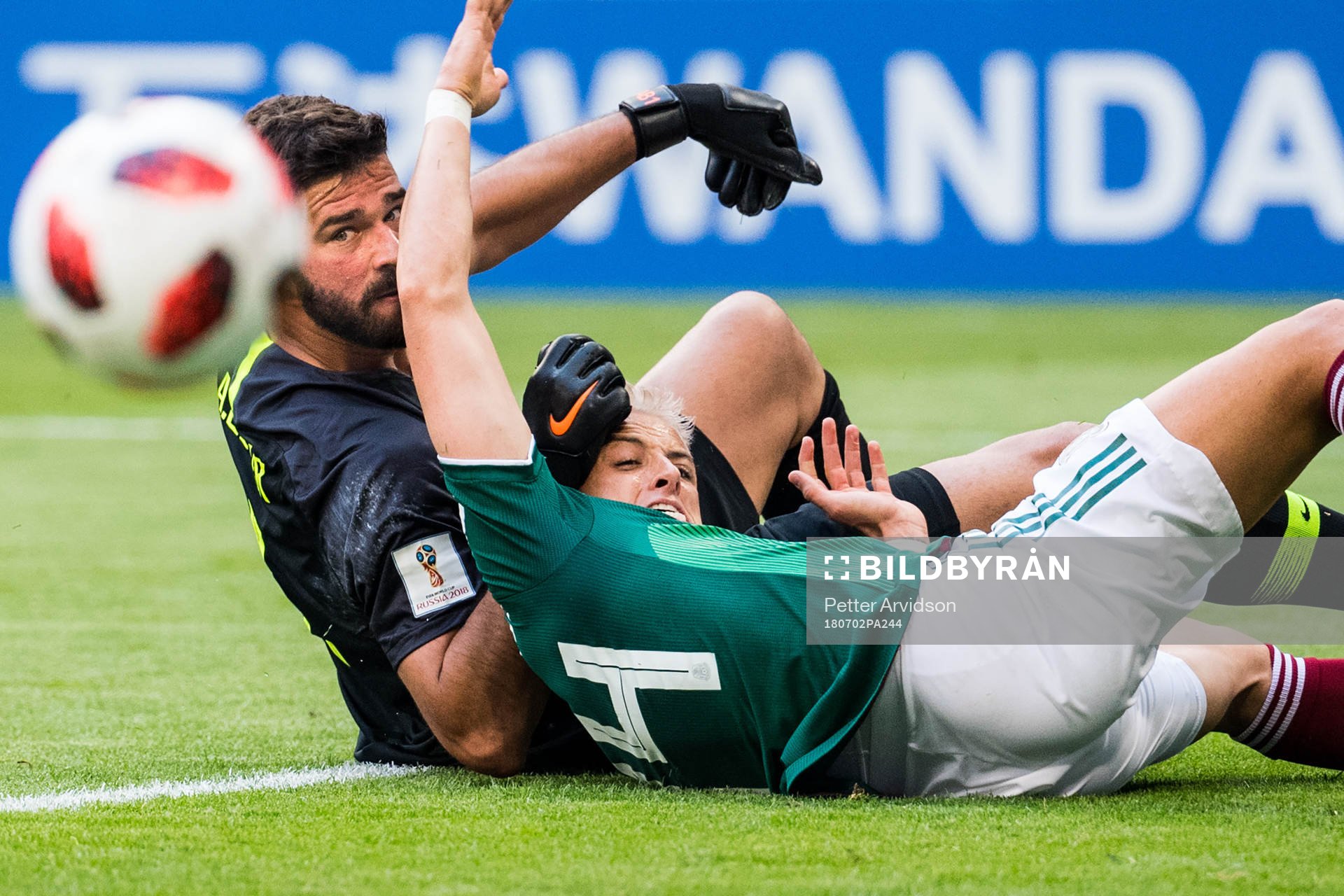 Javier Hernandez of Mexico and goalkeeper Alisson of Brazil