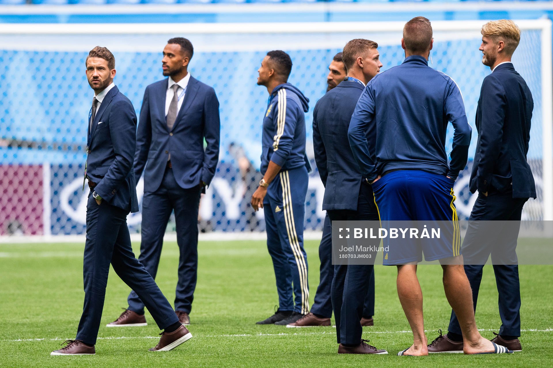 Marcus Rohdén of Sweden inspects the pitch with team mates