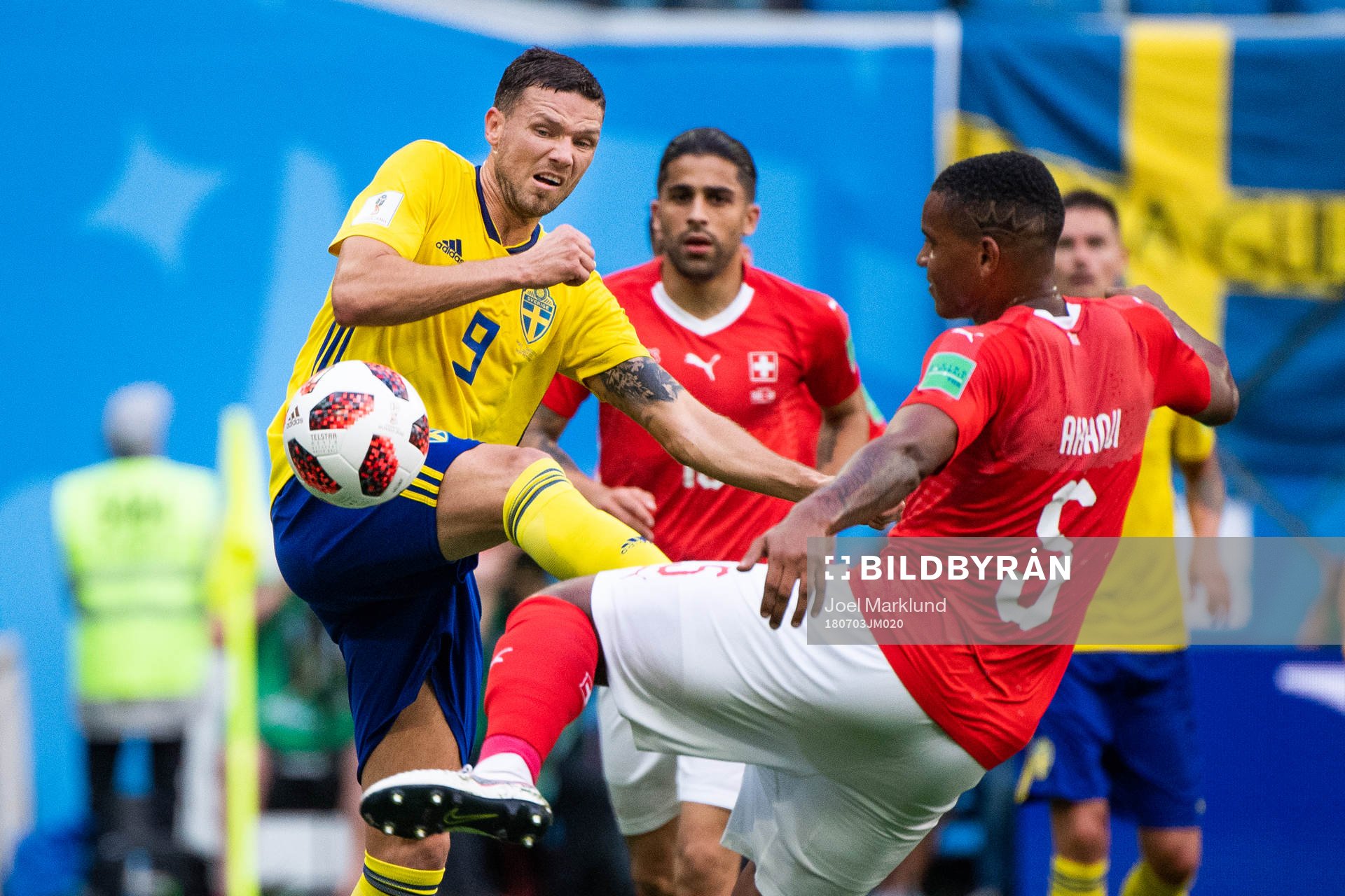 Marcus Berg of Sweden competes for the ball with Manuel