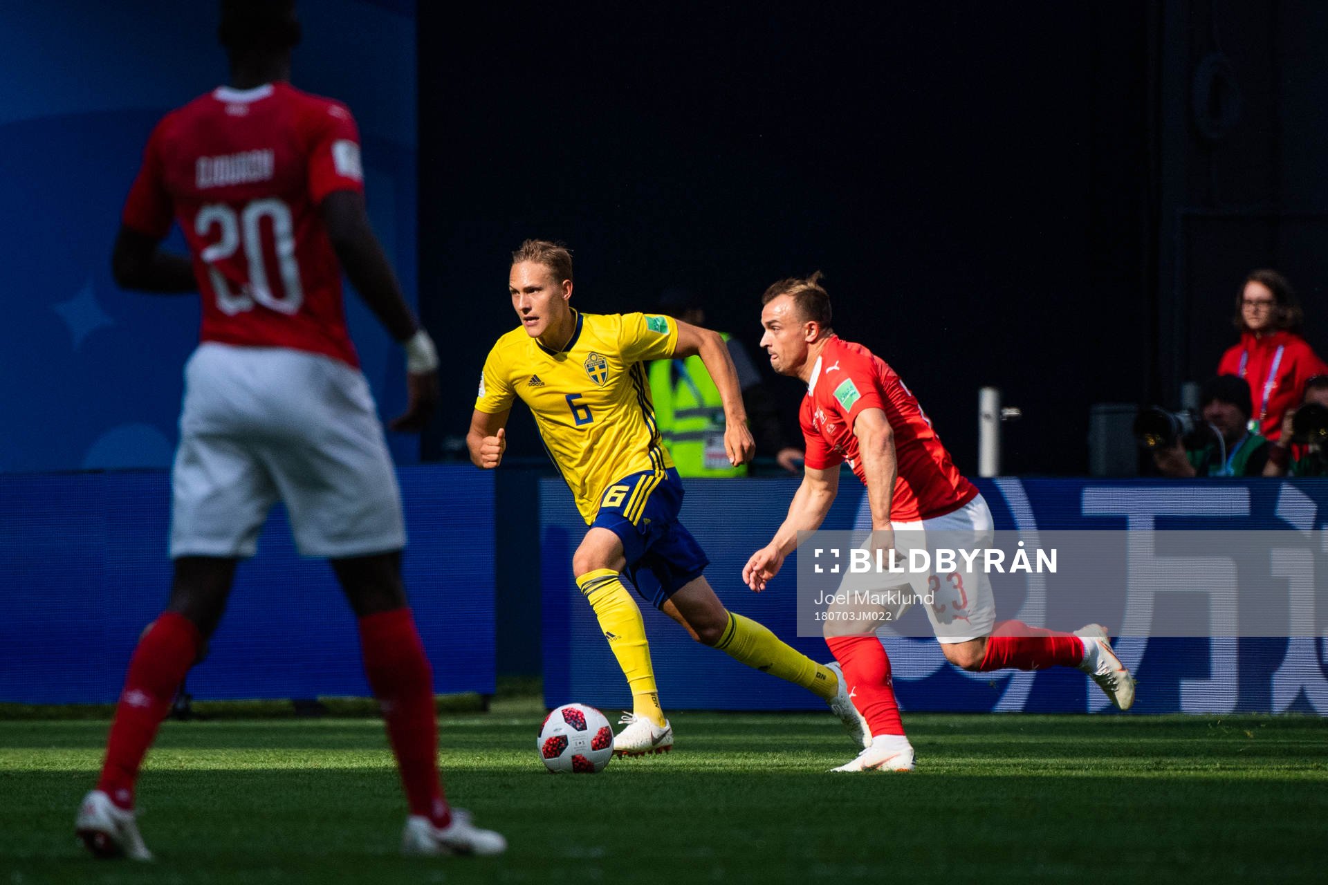 Ludwig Augustinsson of Sweden competes for the ball with