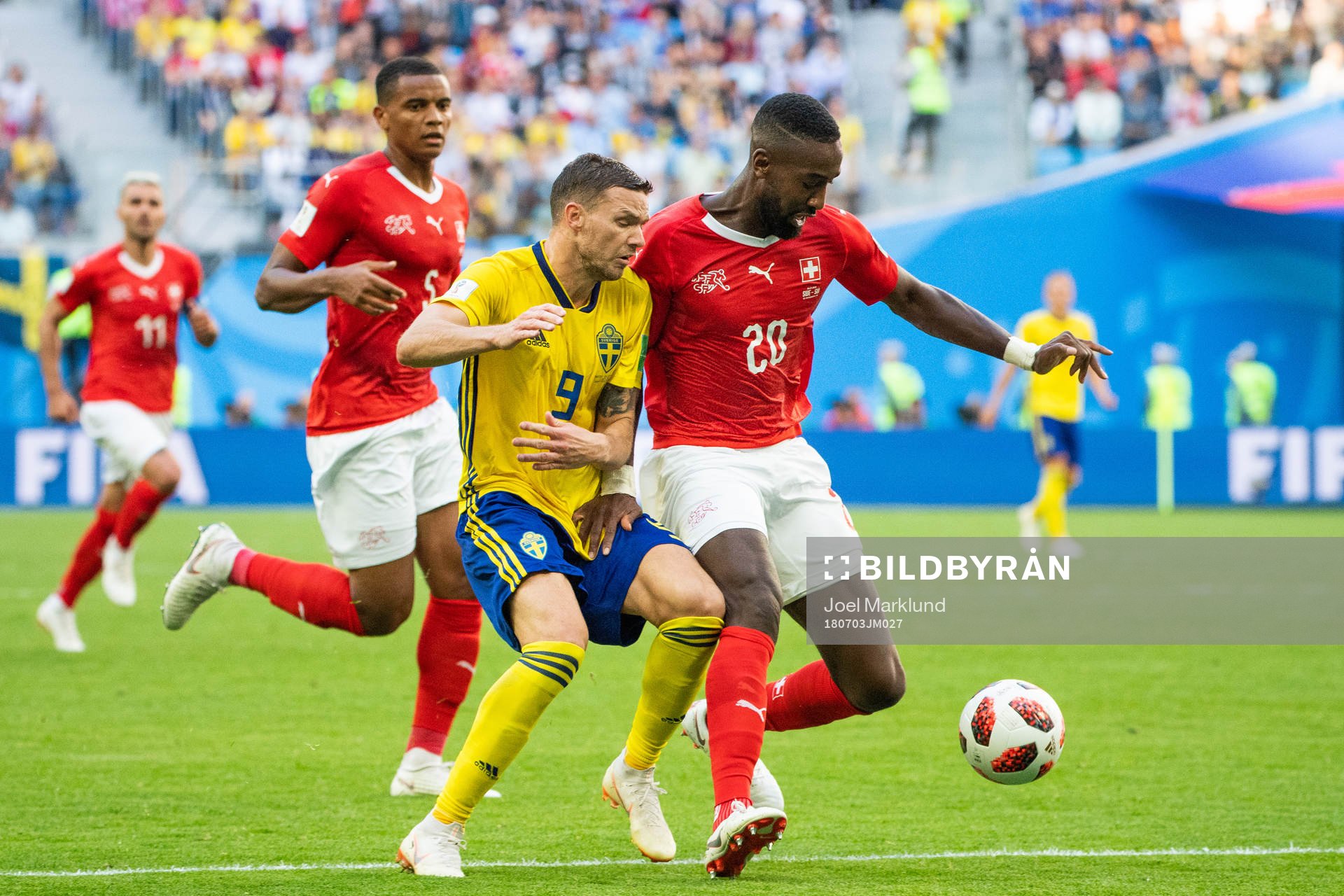 Marcus Berg of Sweden competes for the ball with Johan