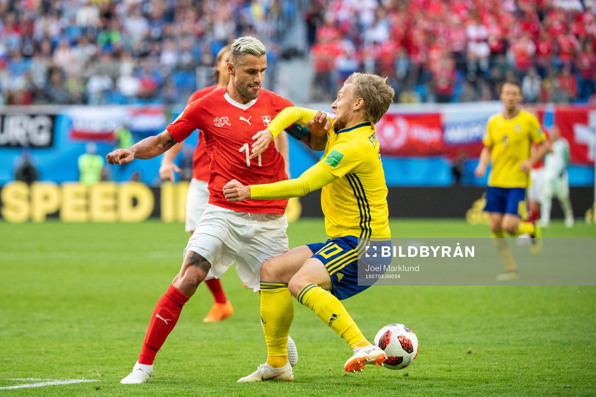 Valon Behrami of Switzerland tackles Emil Forsberg of Sweden