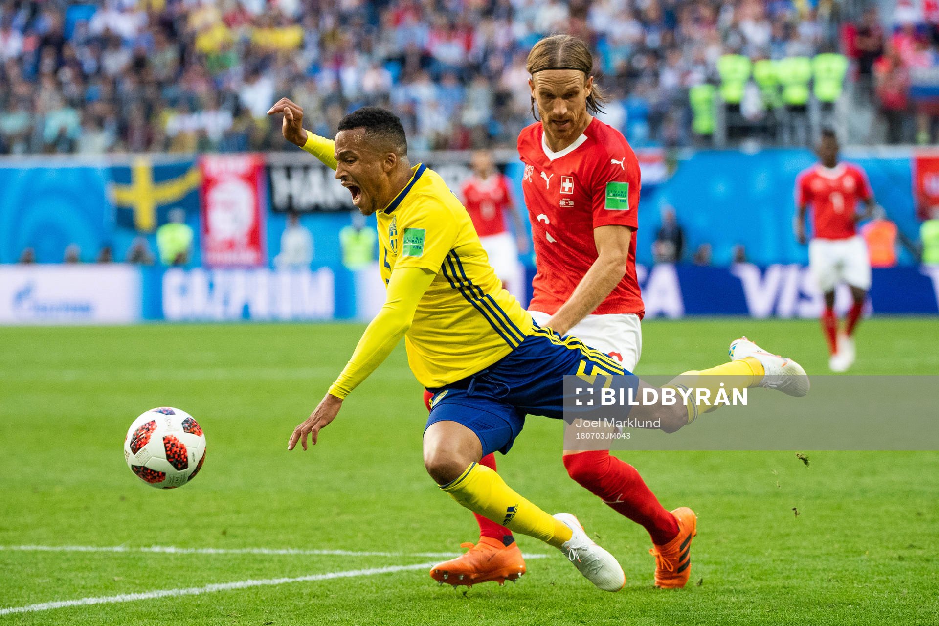 Martin Olsson falls and is awarded a free kick in a duel with Michael Lang of Switzerland during the FIFA World Cup round of 16 match between Sweden and Switzerland on July 3, 2018 in St Petersburg.